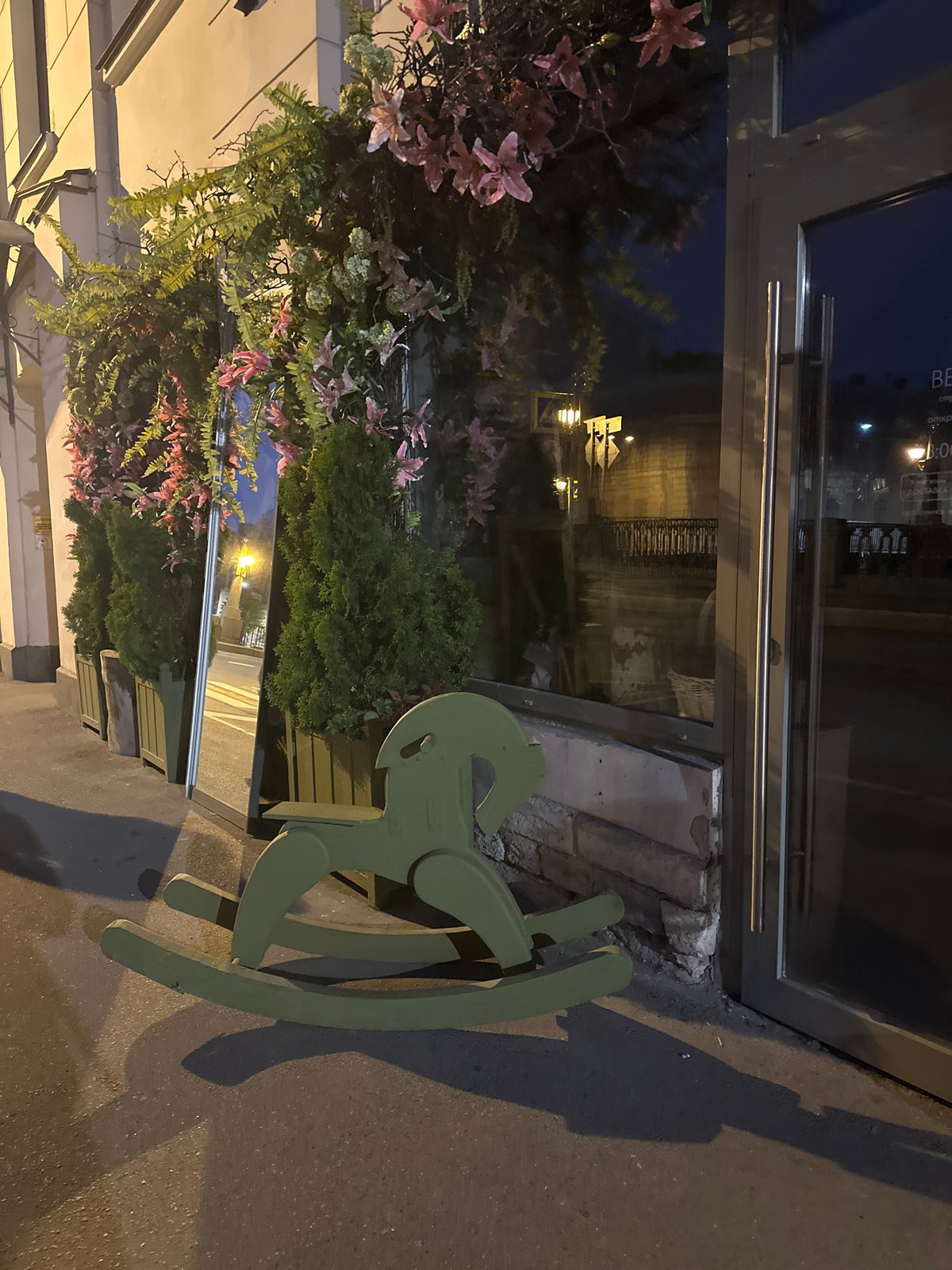 Woman takes selfie near rocking horse in Saint Petersburg
