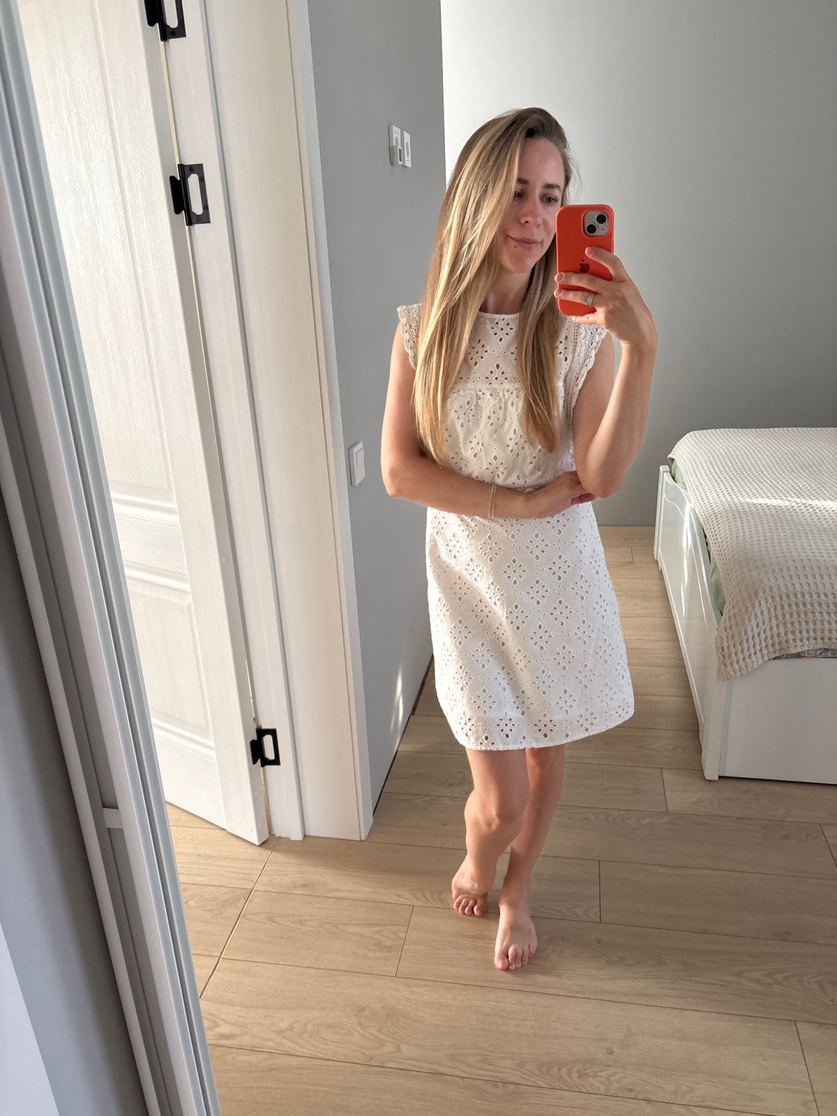 Mirror selfie session in a Chaikovsky apartment, white eyelet dress