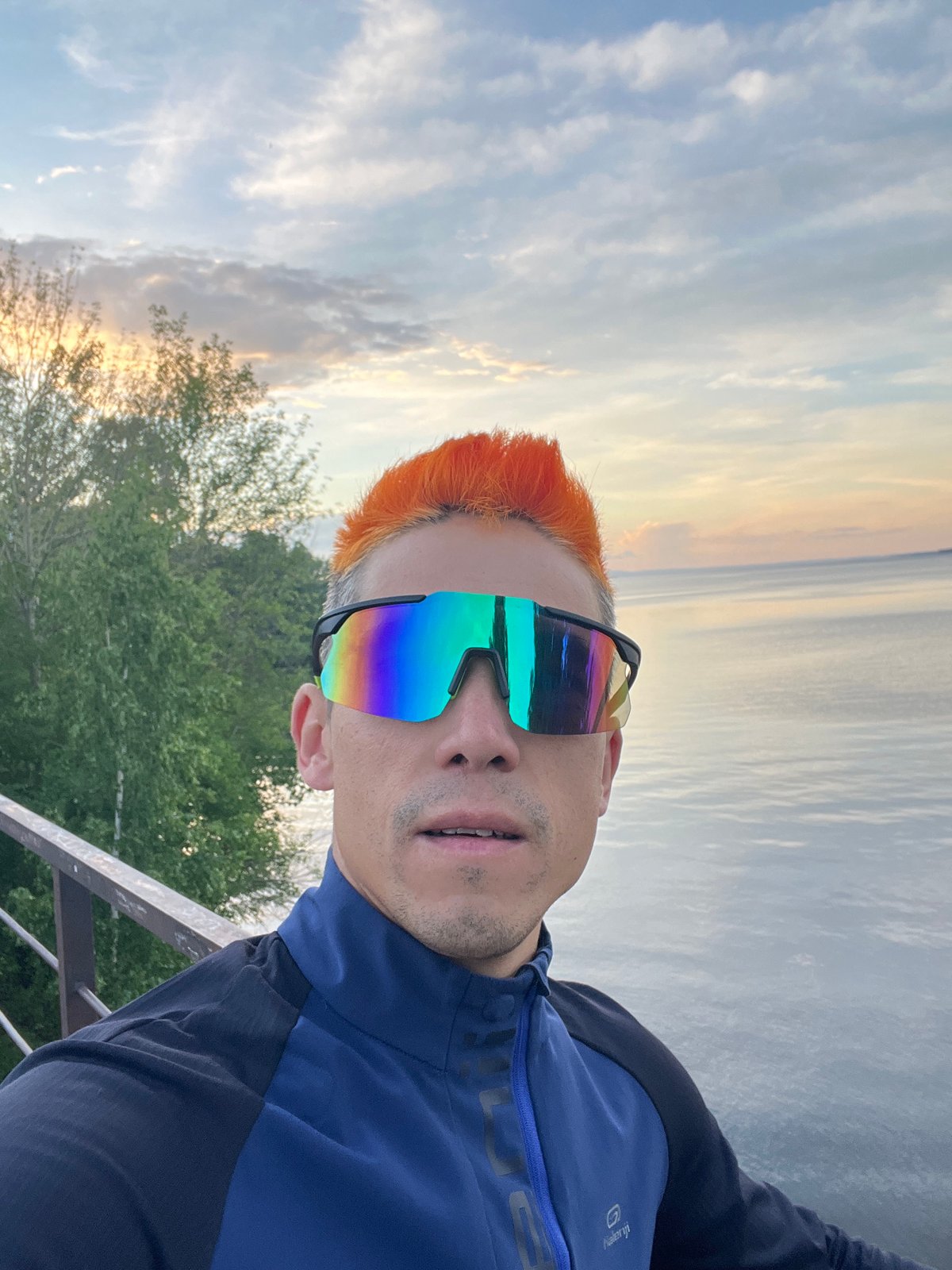 Orange-haired man takes selfies, jumps by waterfront in Chaikovsky