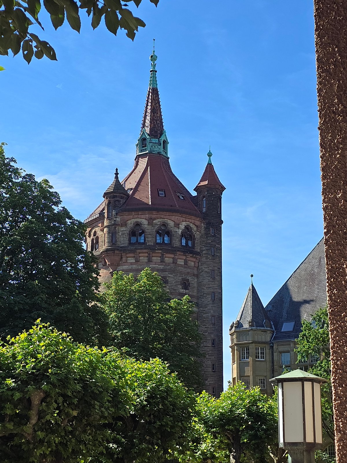 Worms landmarks: water tower, church, and train station on a sunny morning