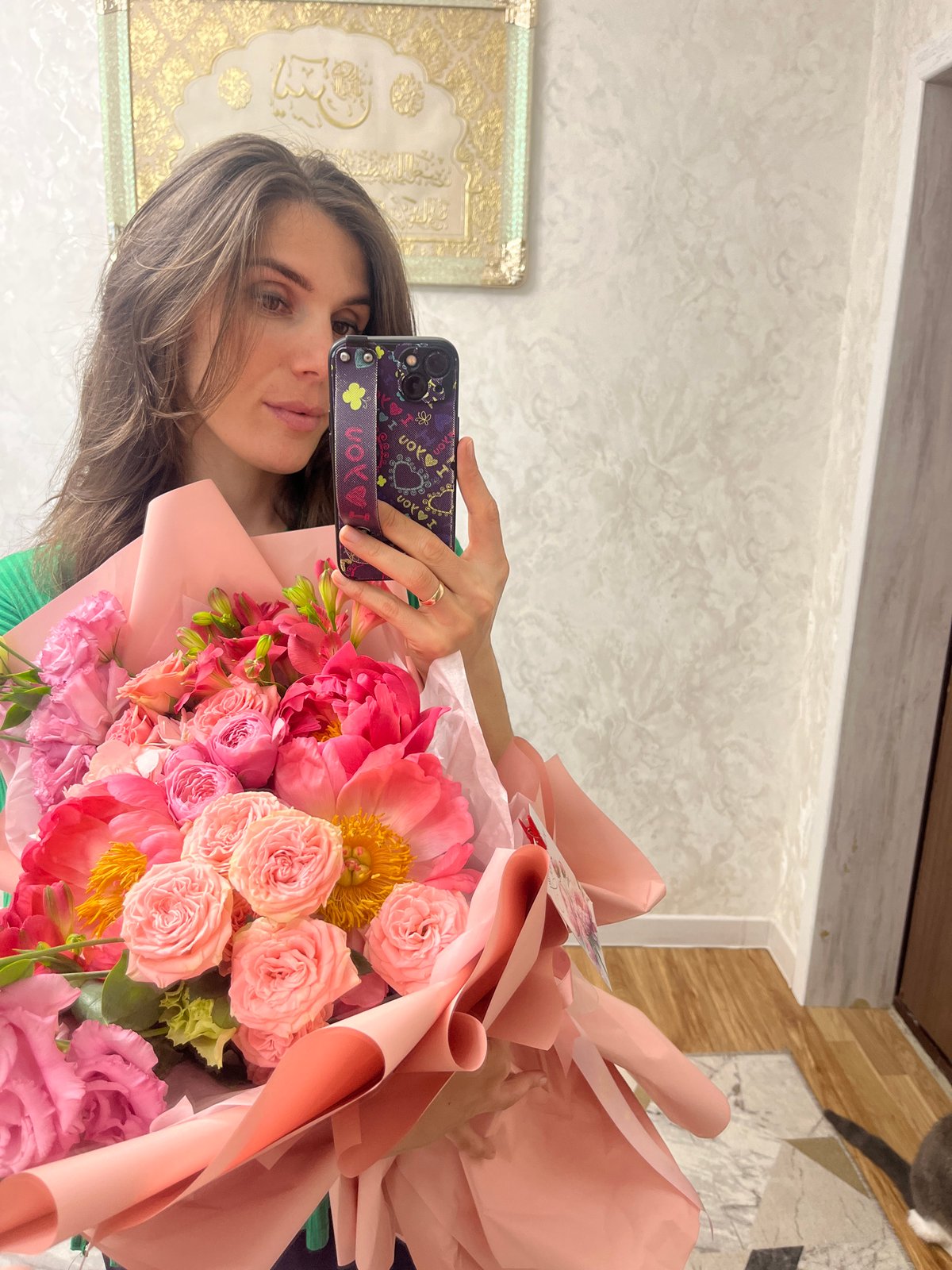 Woman celebrates with flower bouquets in Kaspiysk, Russia