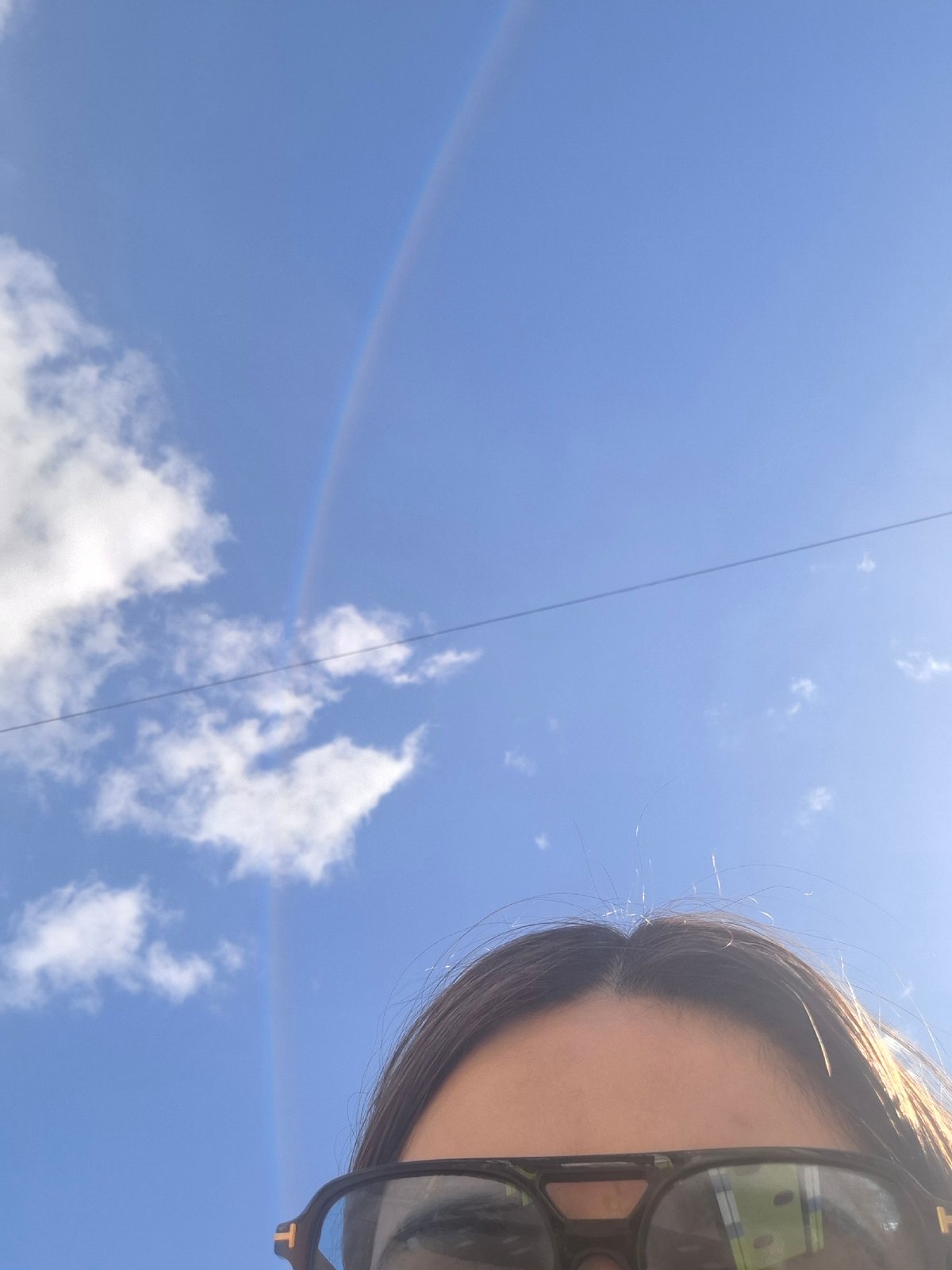 Playground moments captured in Chaikovsky during rainbow weather