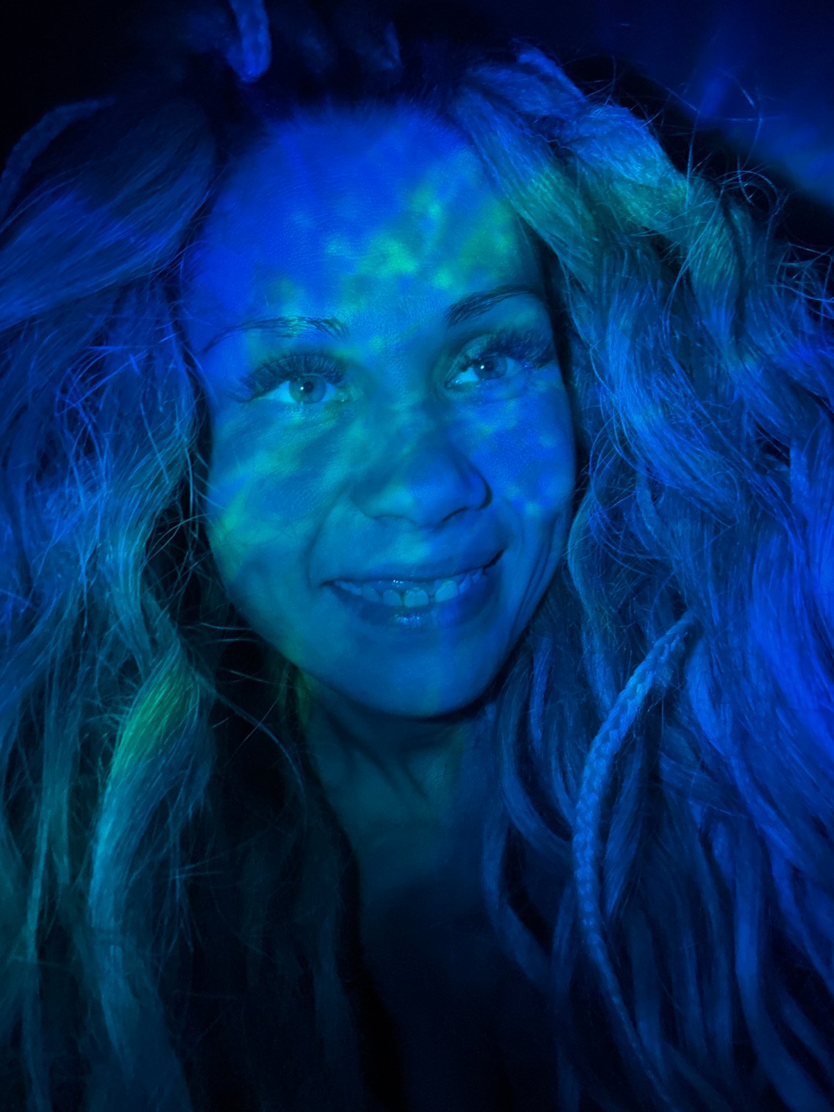 Woman photographed with colored lighting effects in Rusanovo, Russia