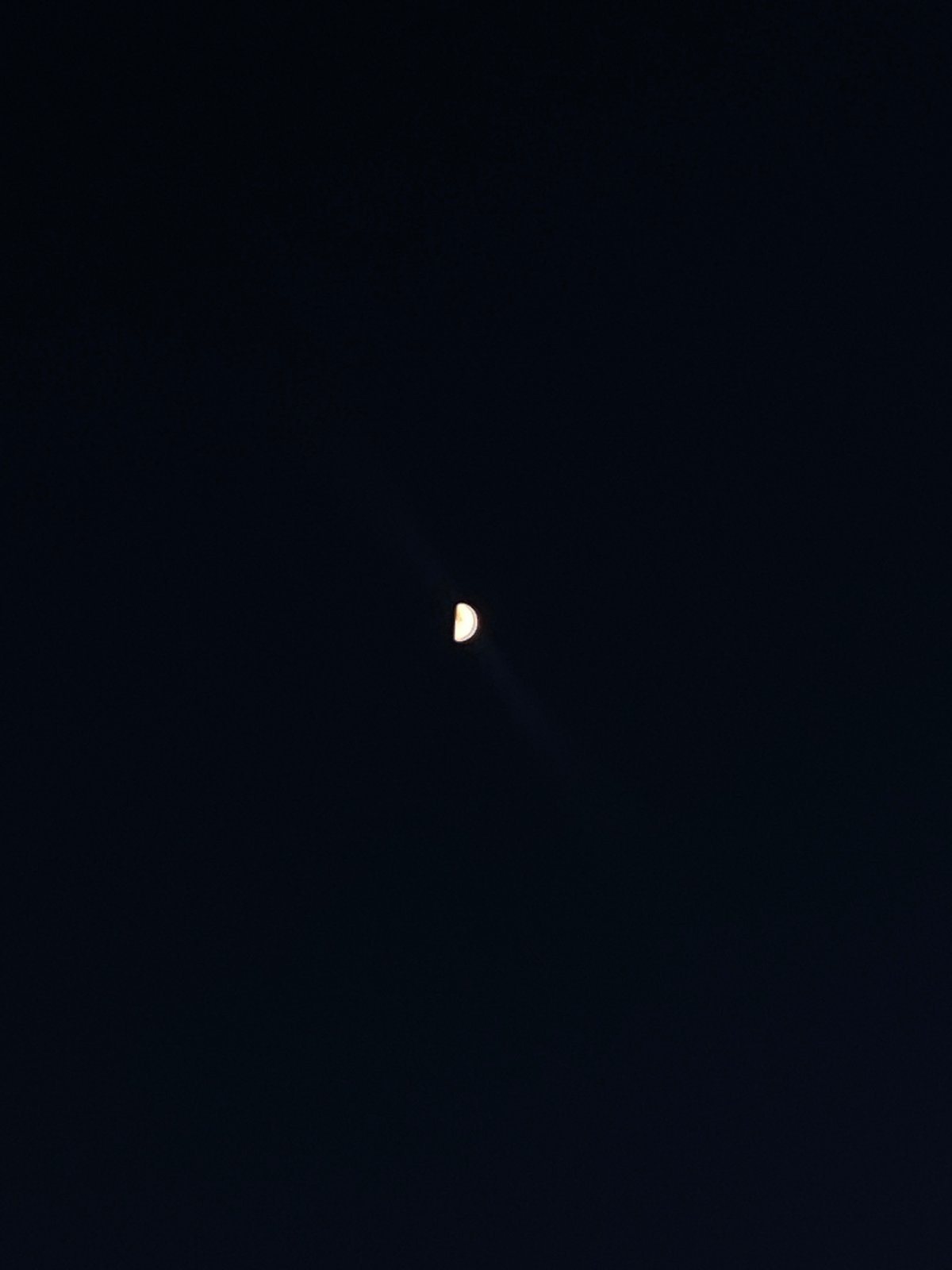 Crescent moon photographed in night sky over Шебунино, Russia