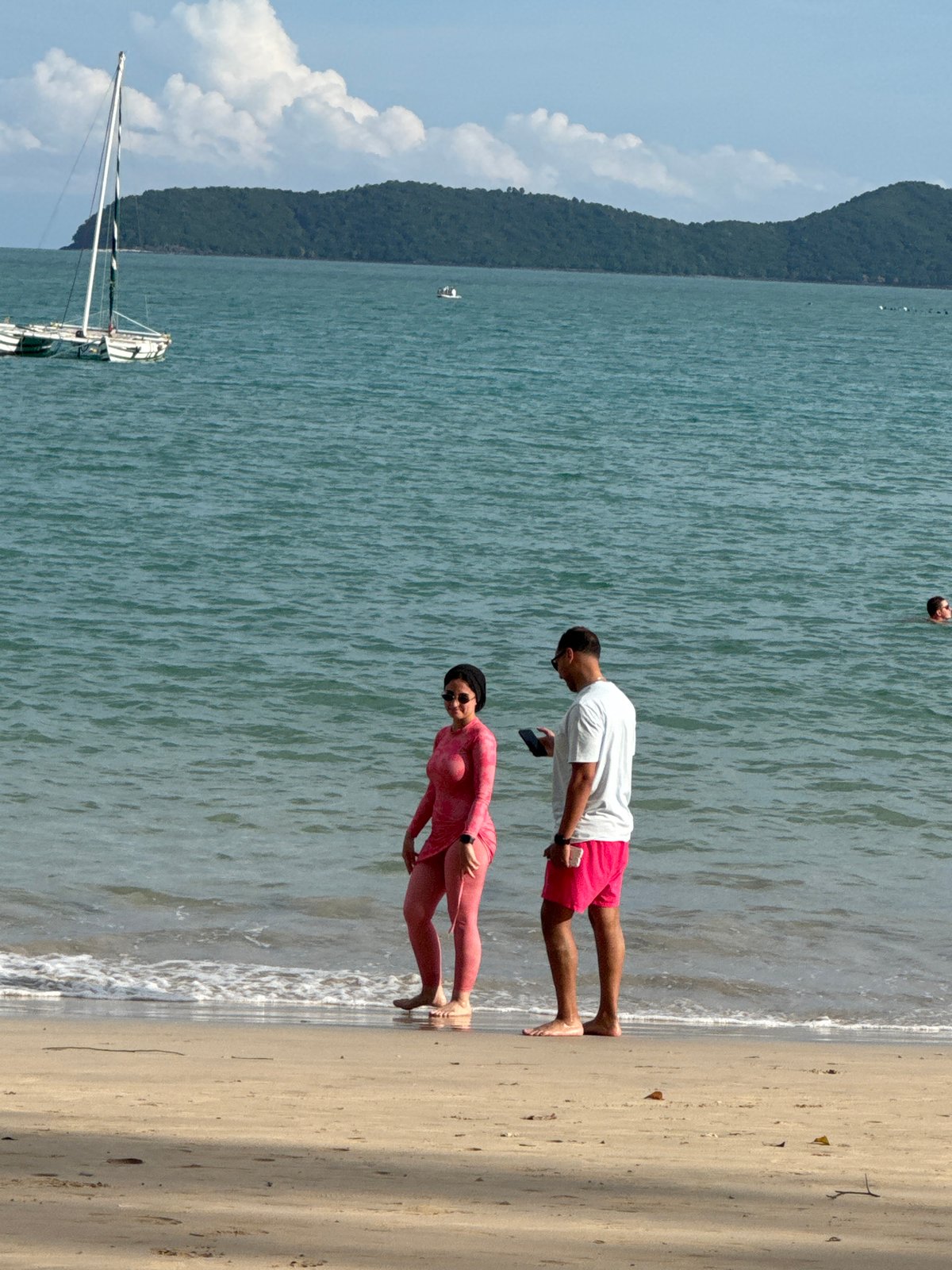 Beach day in Wichit — swimming, sunbathing, rocky shoreline hangouts