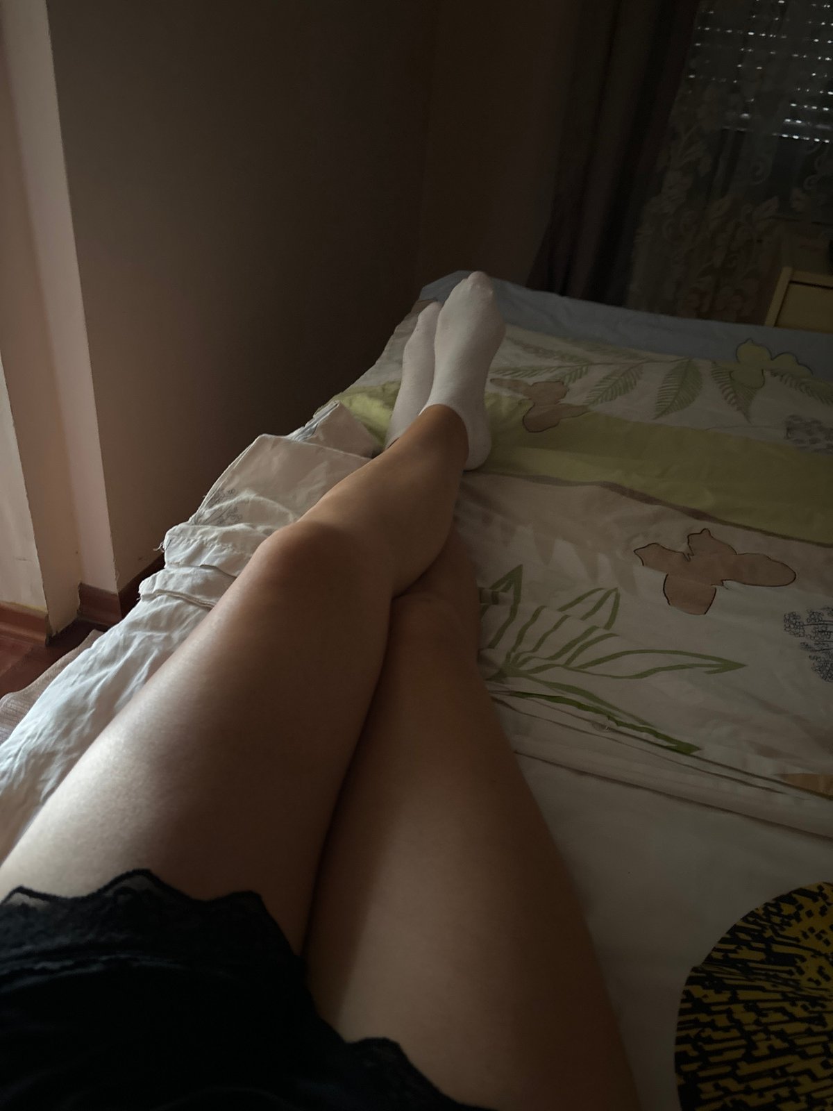 Lazy afternoon in a Budva room, flowers, a dog, café views.