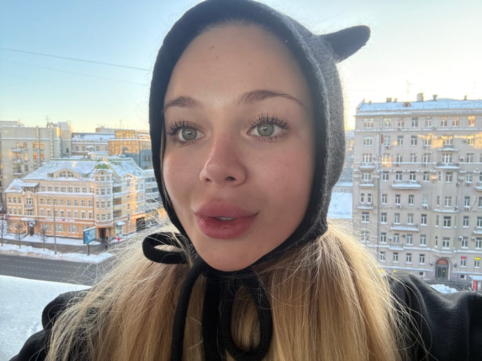 Young Woman Documents Winter Day Across Urban Setting