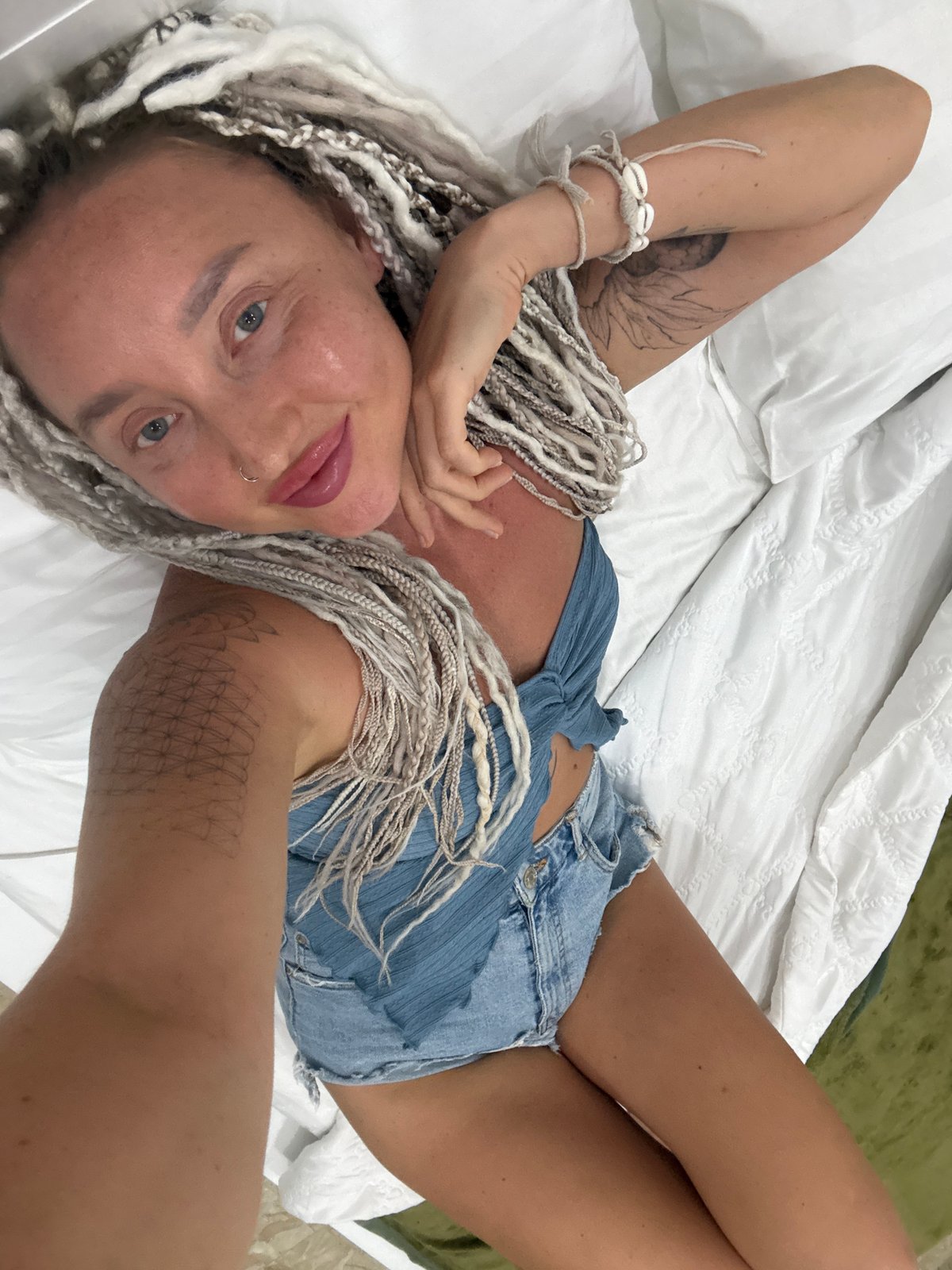 Lounging on a hotel bed in Nha Trang, Vietnam