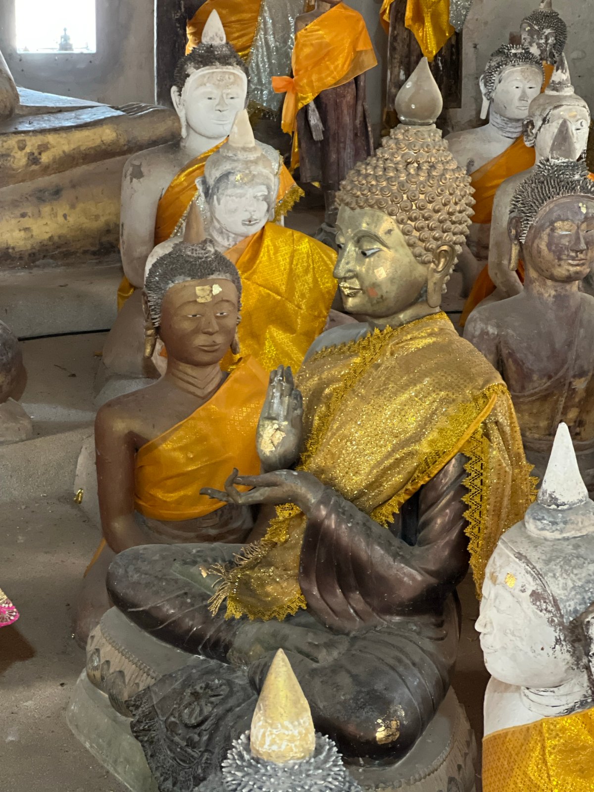 Inside a Ko Samui temple's weathered Buddha statue collection