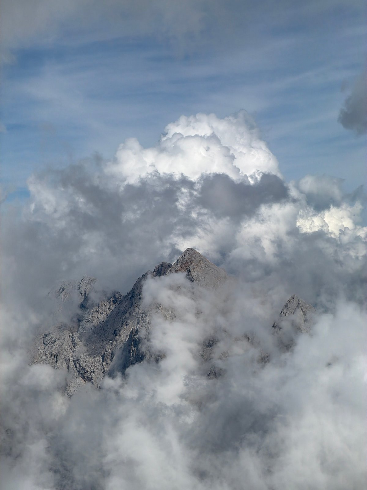 Modern mountain complex emerges from rocky Austrian alpine terrain