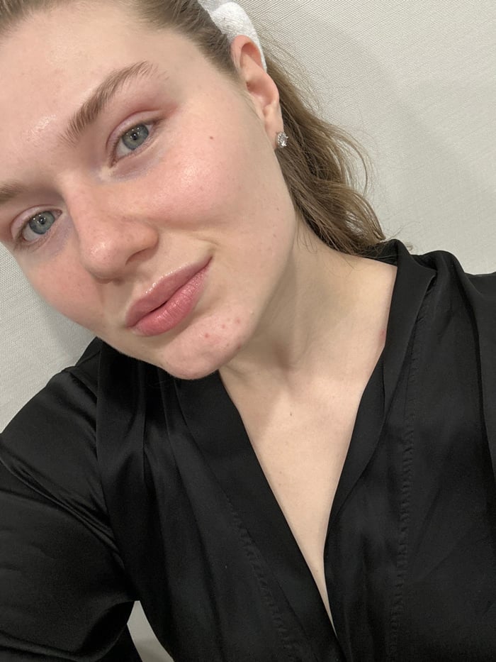 Woman Documents Evening Skincare Routine in Kazan Bathroom
