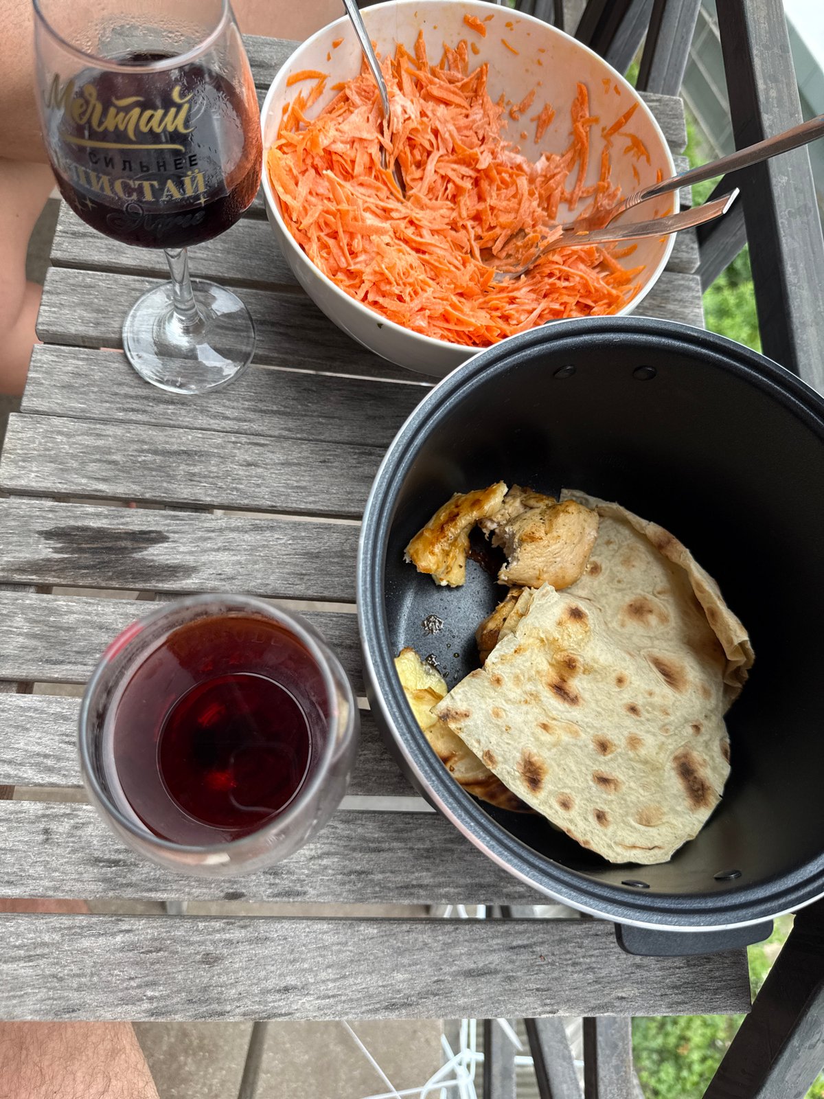 Balcony meal with grilled chicken and wine in Sochi