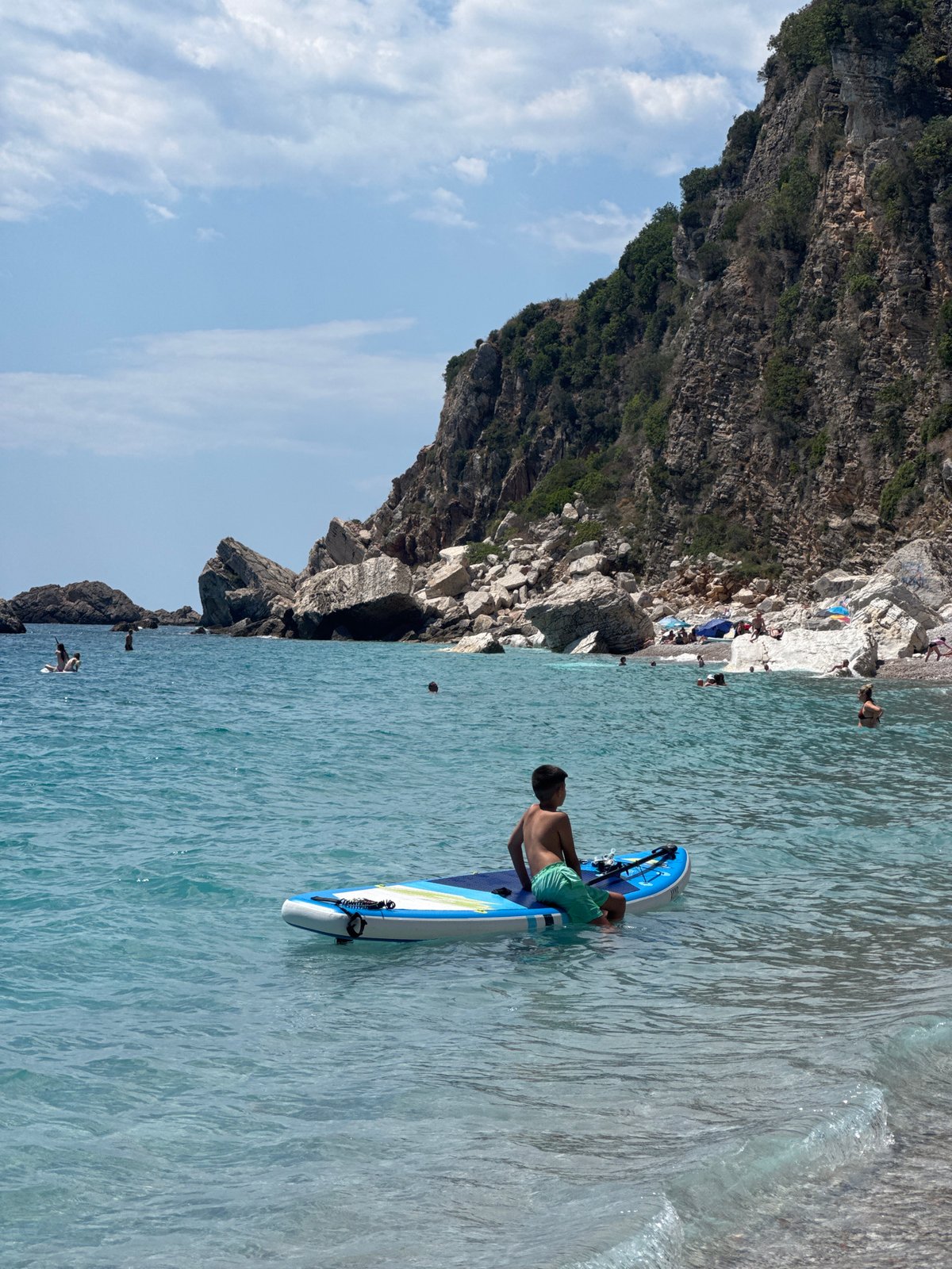 Summer day on the pebble beach at Mirište, Montenegro