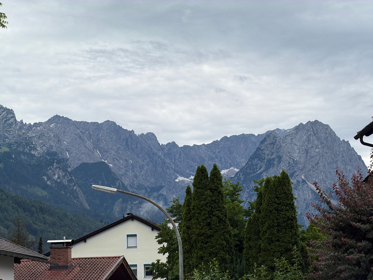 Alpine peaks and rooftops in Garmisch-Partenkirchen on a cloudy afternoon