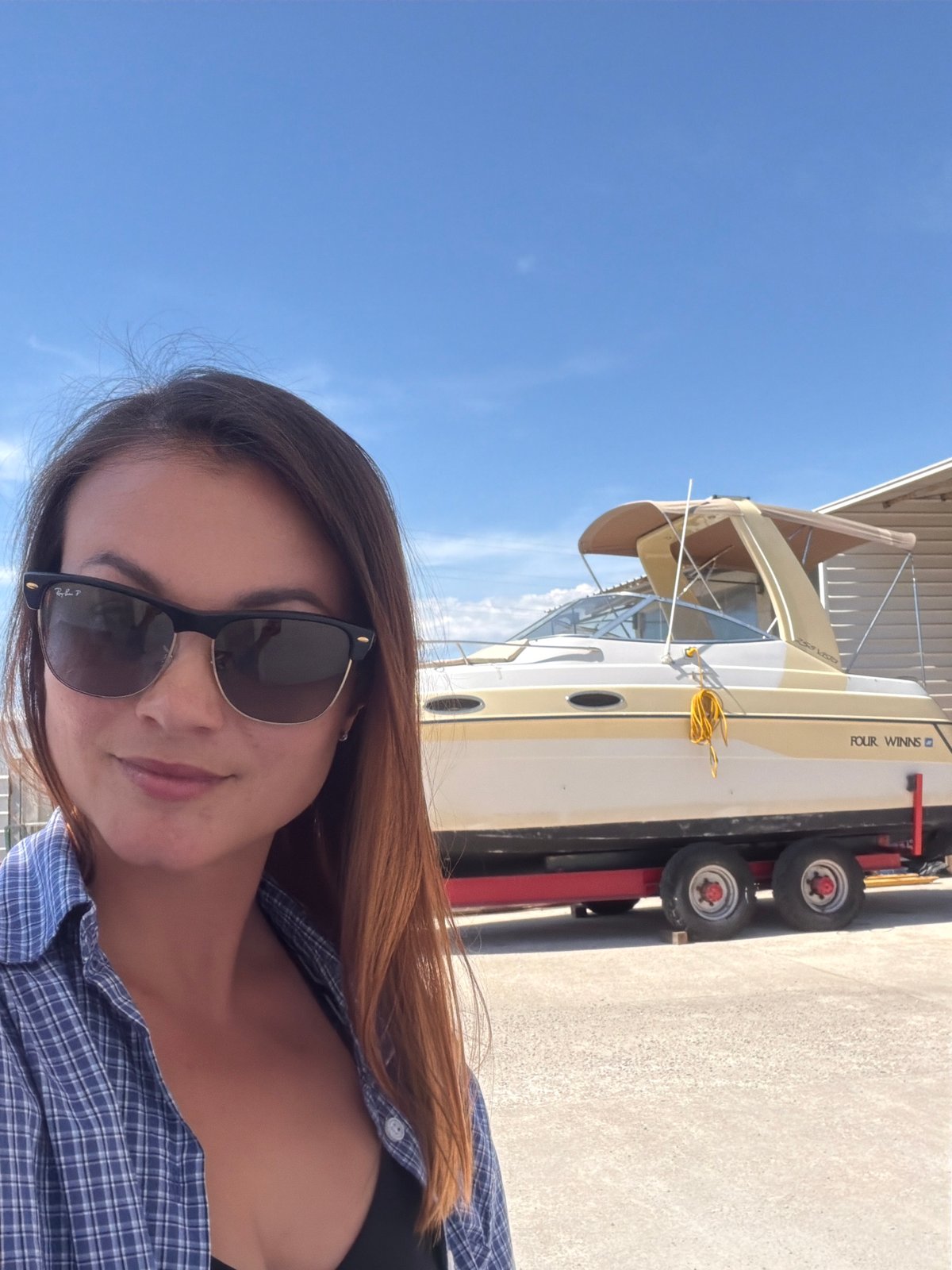 Woman takes selfies in Radanovići, Montenegro on sunny day