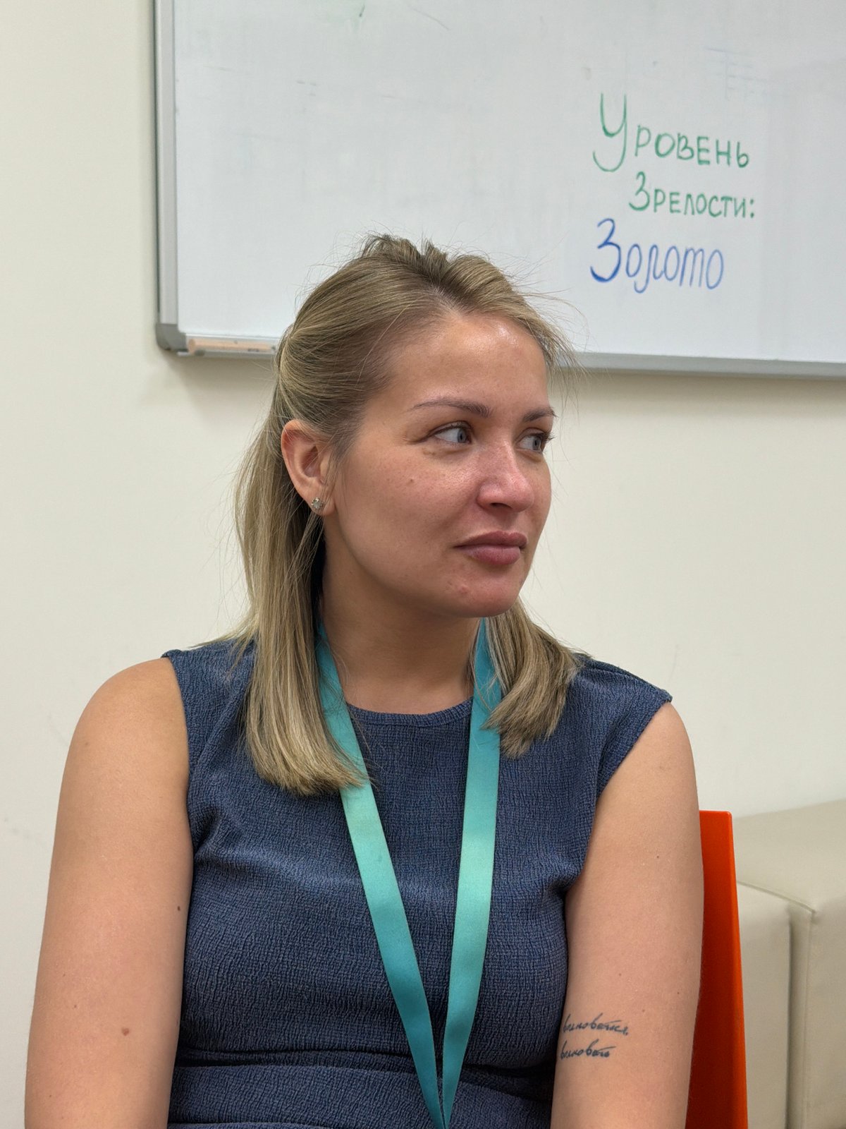 Woman observed studying whiteboard in Krasnoyarsk classroom setting