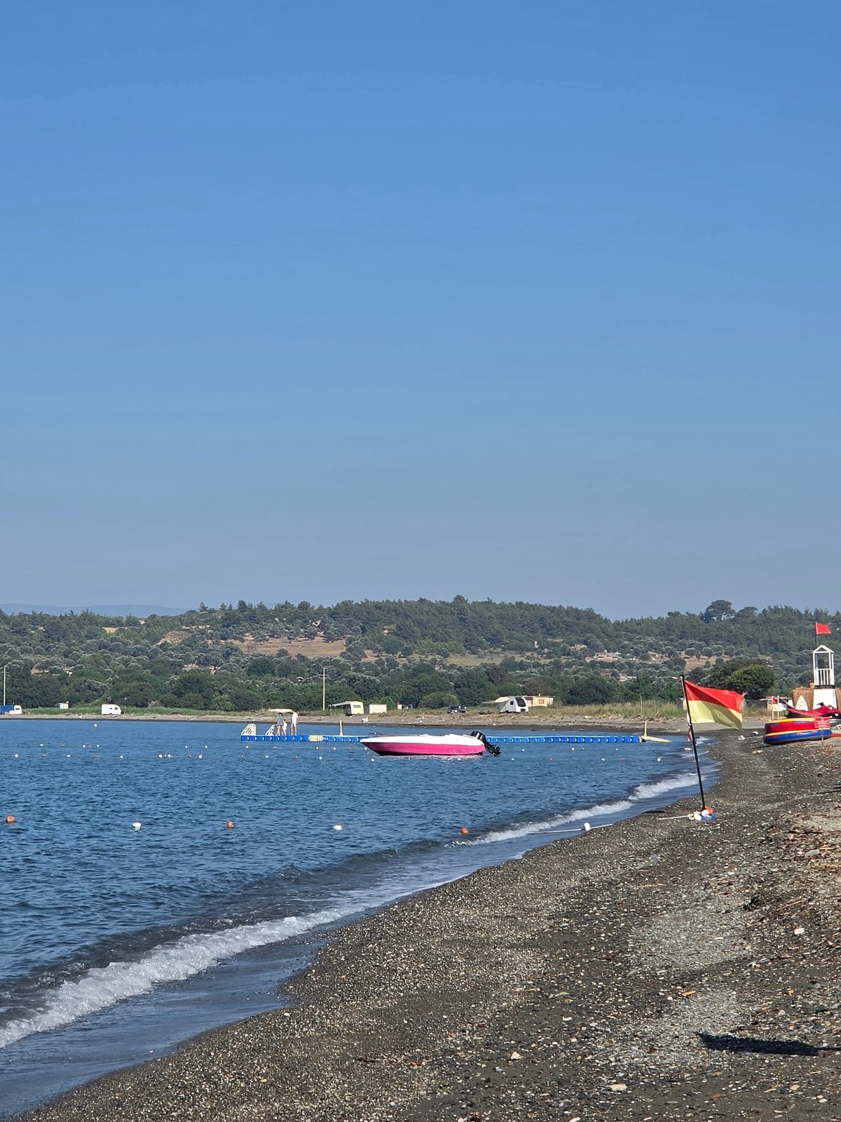 Quiet morning at a pebble beach in Seferihisar, Turkey