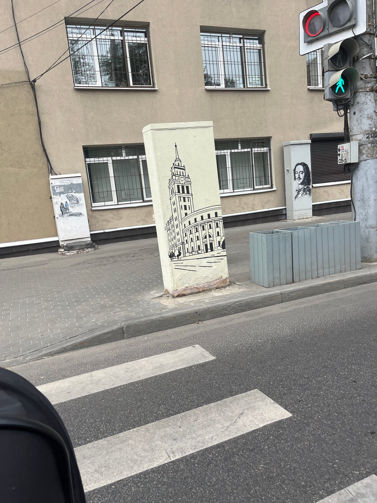 Mural-covered building facade at a Voronezh street corner