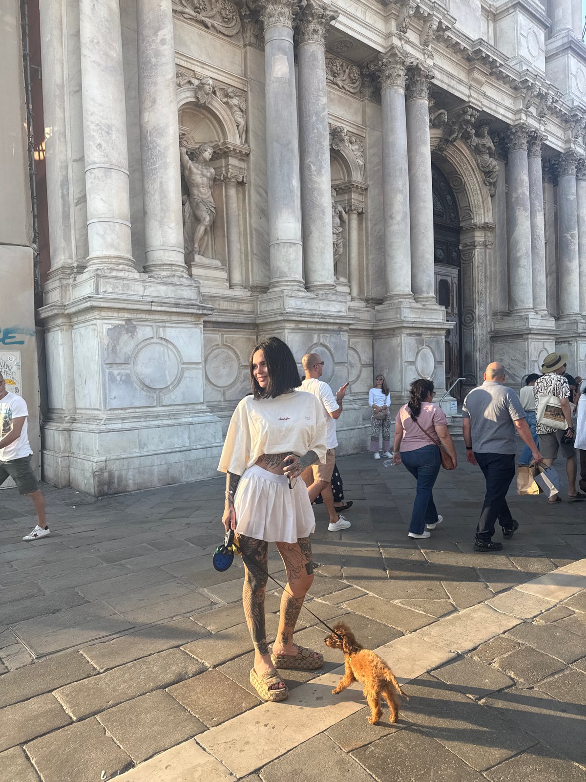 Tourists visit baroque architecture near Church of San Stae, Venice