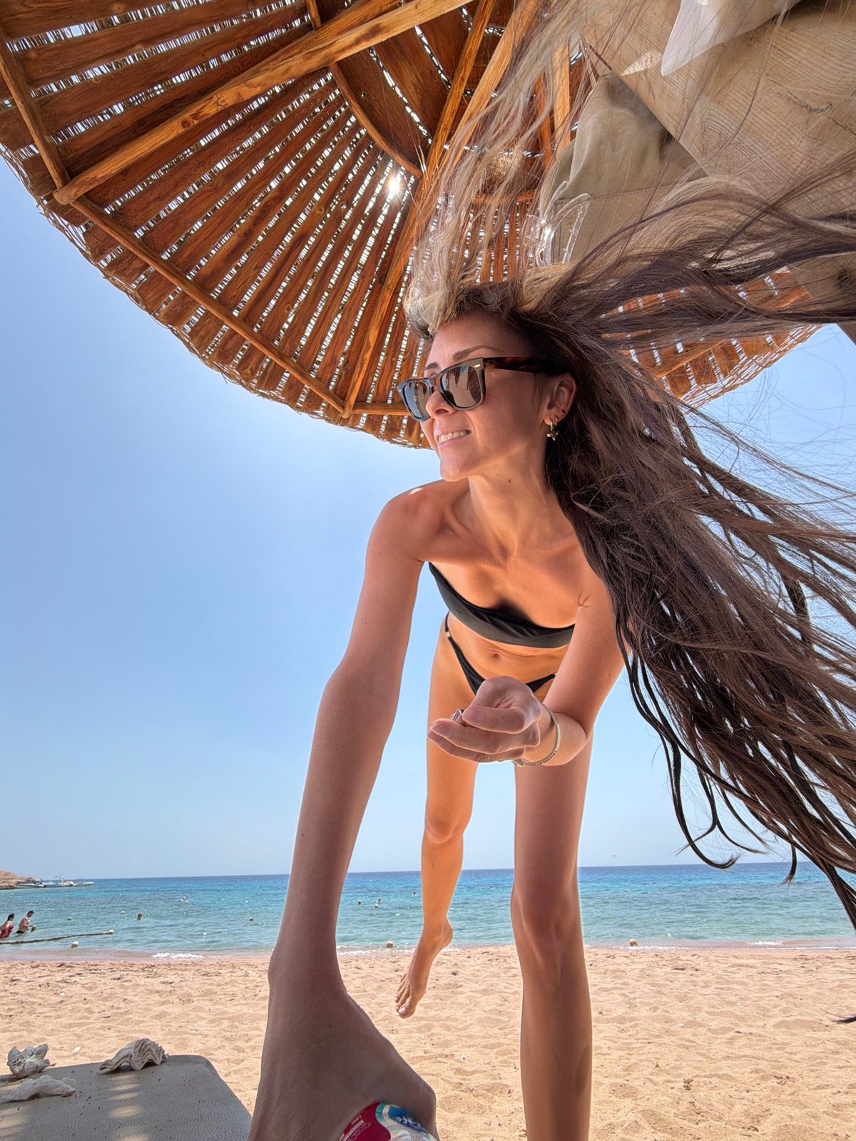 Woman enjoys sunny beach morning in Sharm El Sheikh