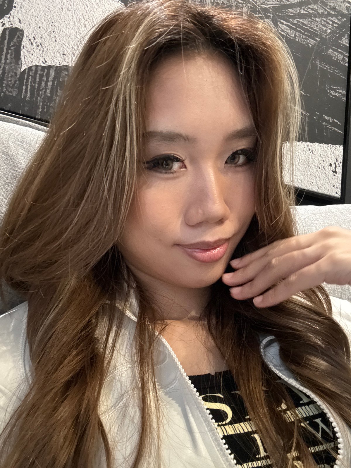 Woman takes selfies on couch in Liangjiang, China