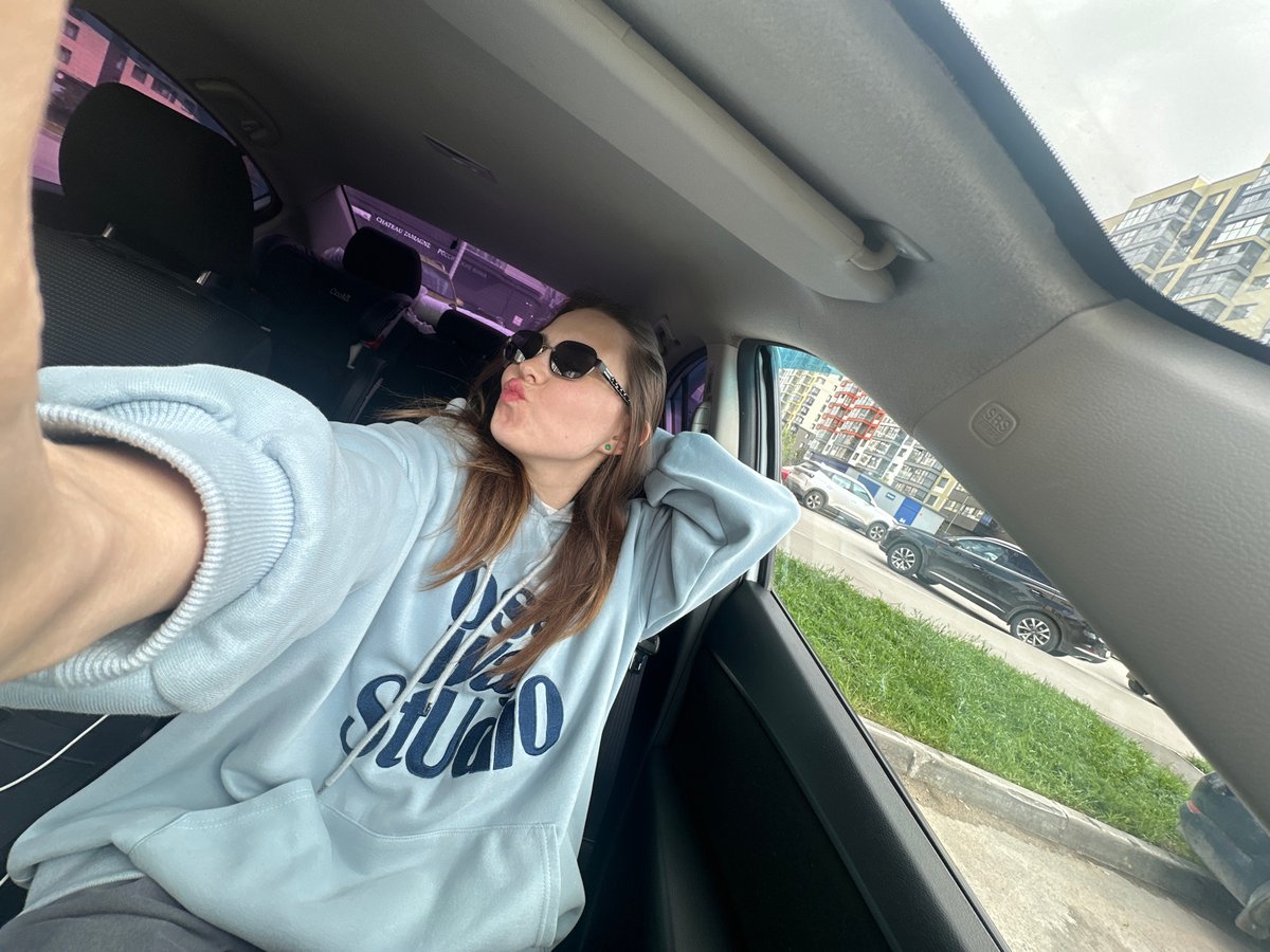 Person in sunglasses observed in parked car in Perm