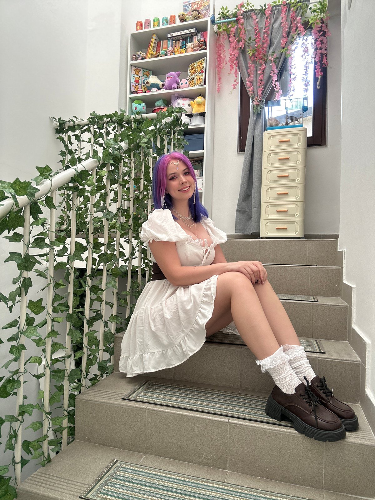 Woman poses for photos on decorated staircase in Zagreb
