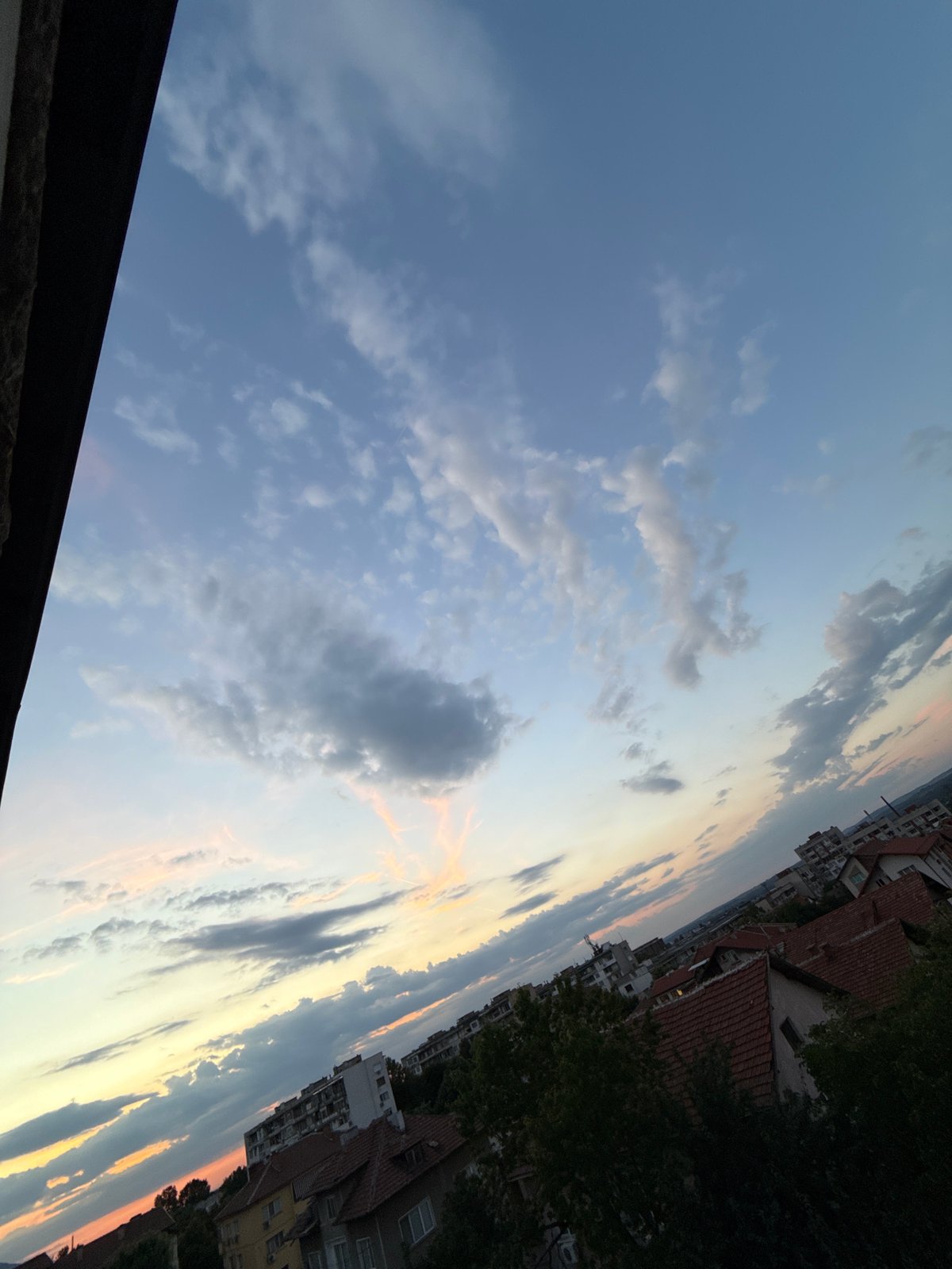 Dusk settles over Vratsa, clouds lit up in evening color