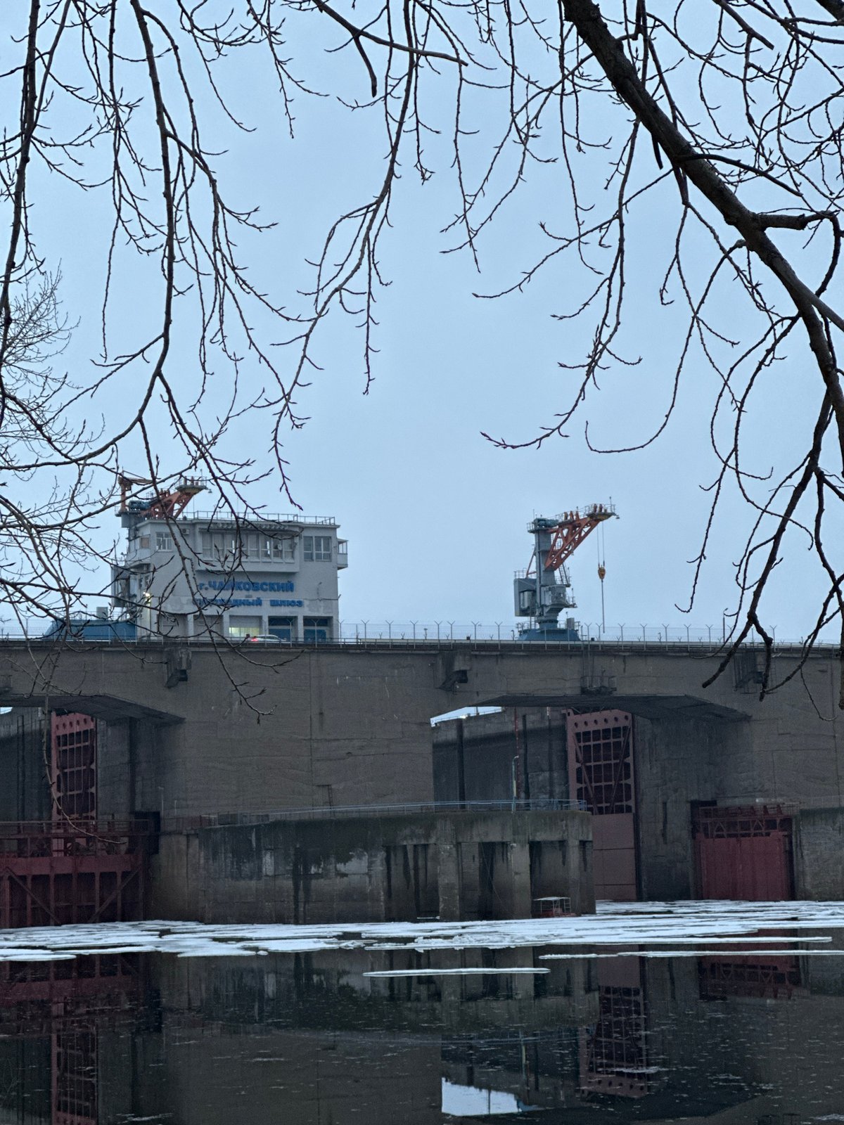 Person documents springtime scenes across Chaikovsky, Russia industrial areas
