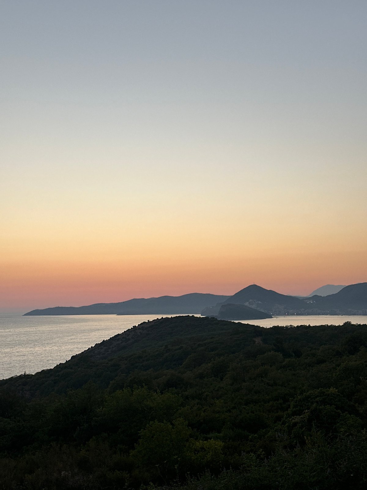 Sunset and a stone fountain in Drobnići, Montenegro