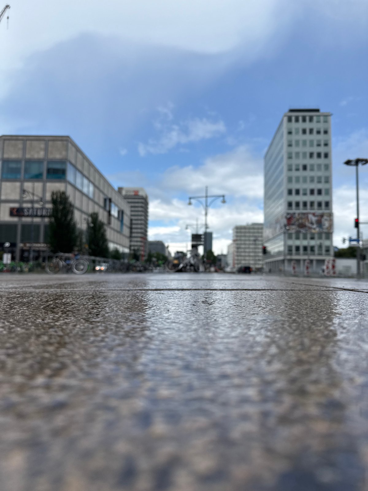 Berlin transit scenes around Alexanderplatz on rainy afternoon