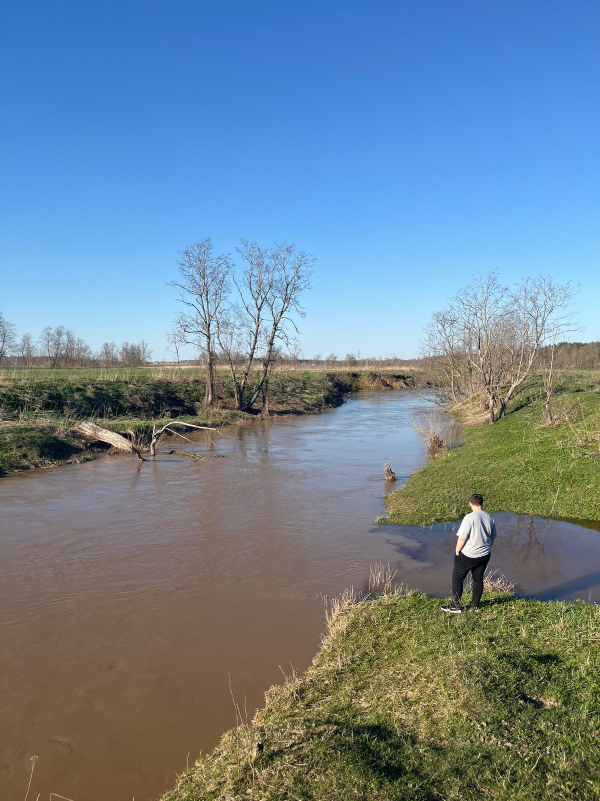 Witnesses document muddy river scenes near Voronino, Russia