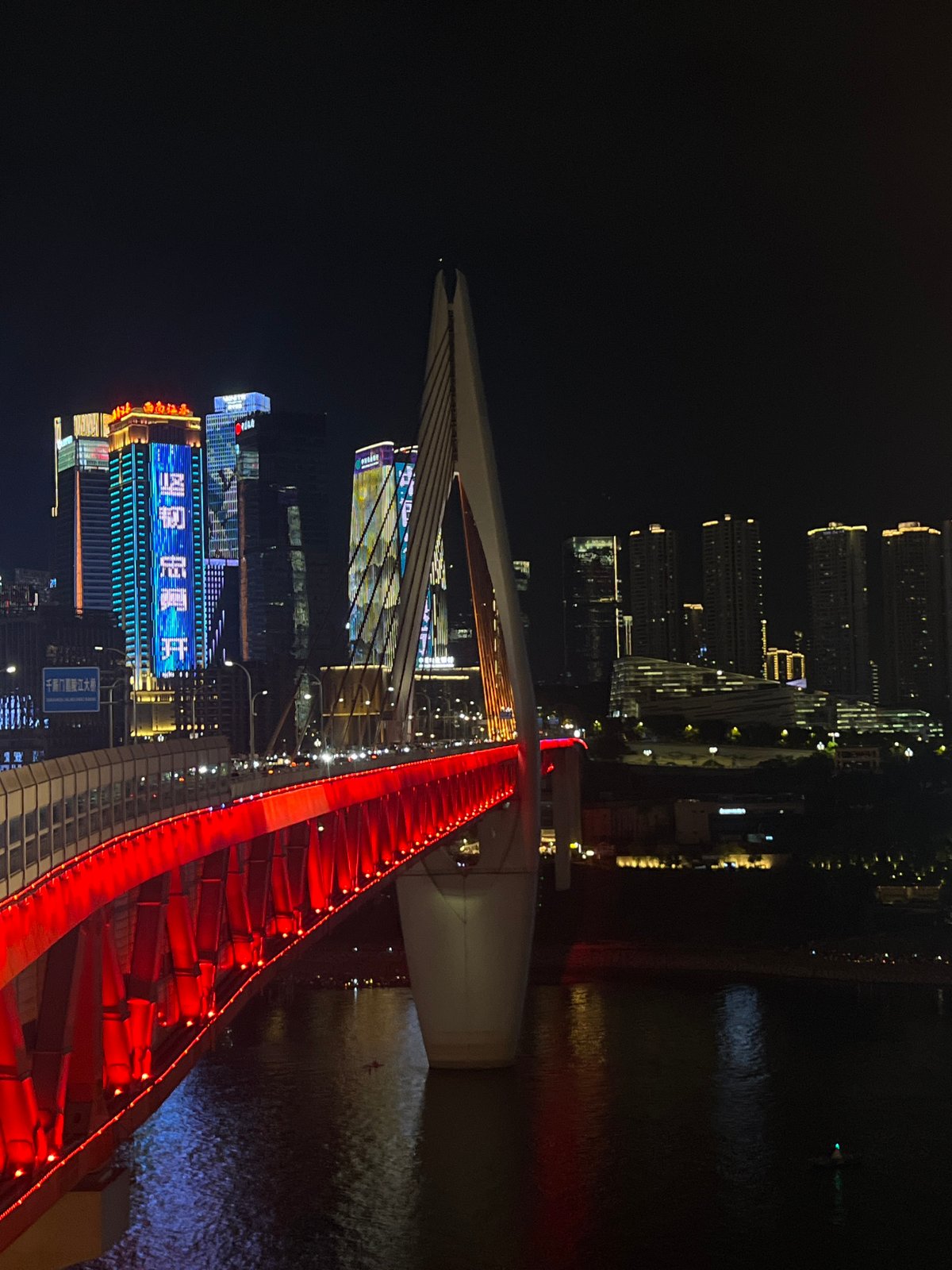 Hongyadong Bridge lit up red along Chongqing's Yangtze waterfront