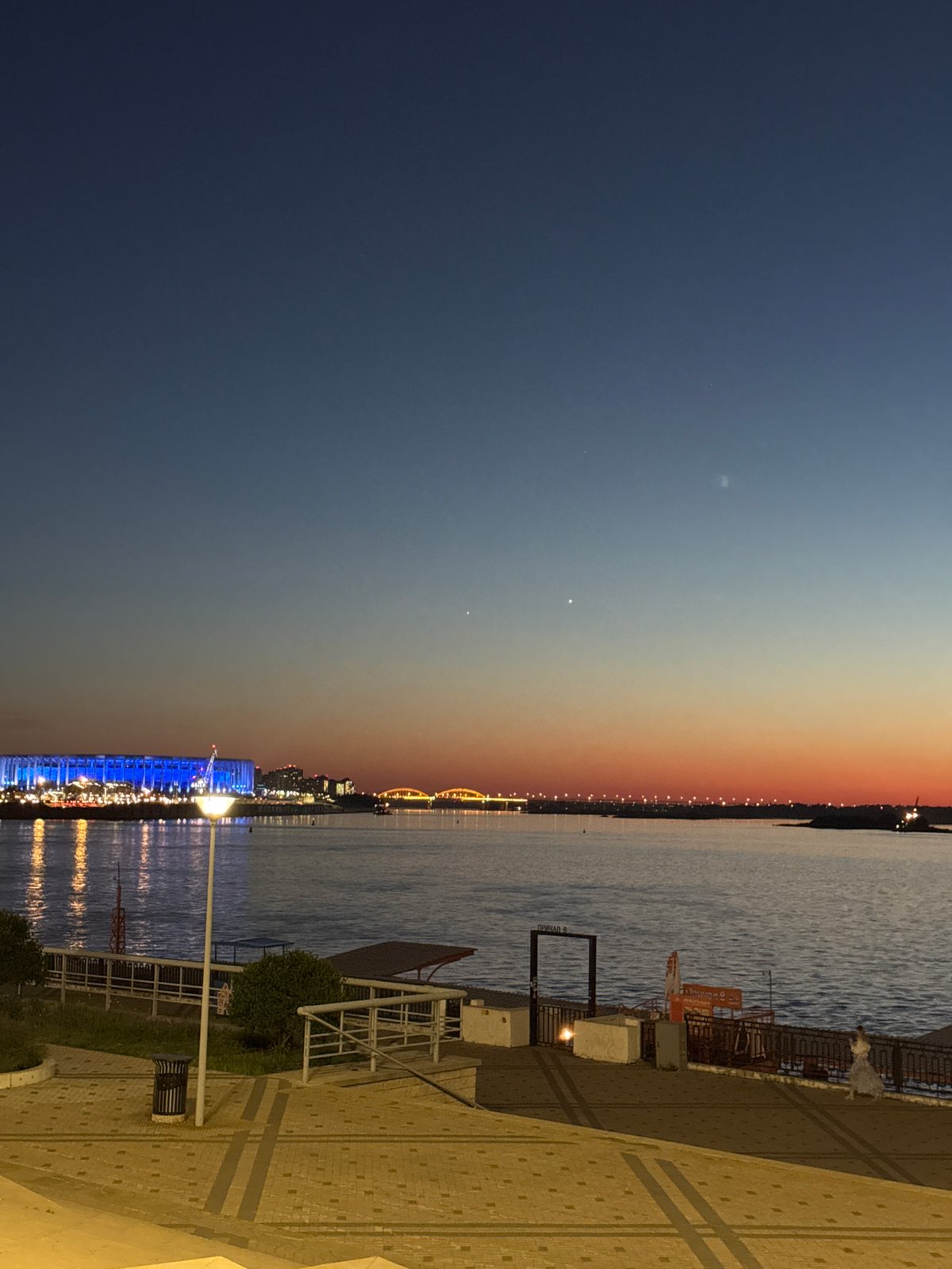 Evening stroll documented through illuminated Nizhny Novgorod landmarks and riverfront