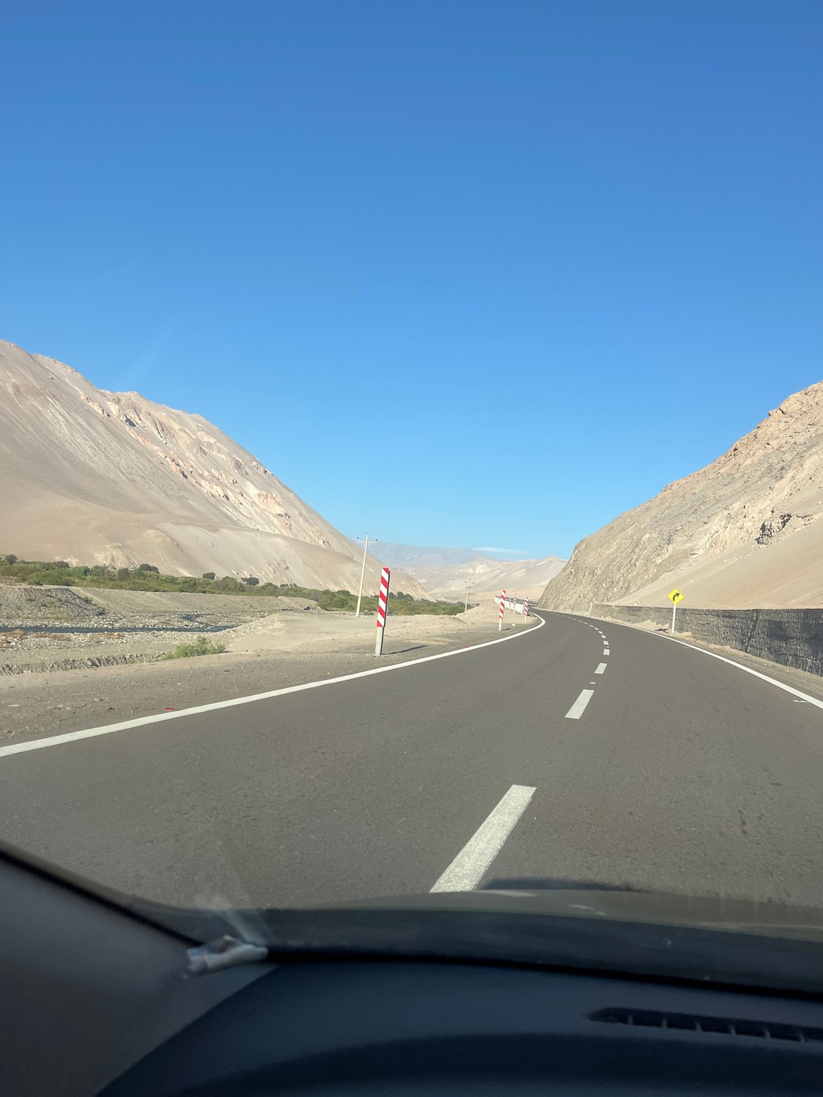 Driver navigates curved road in Arica, Chile