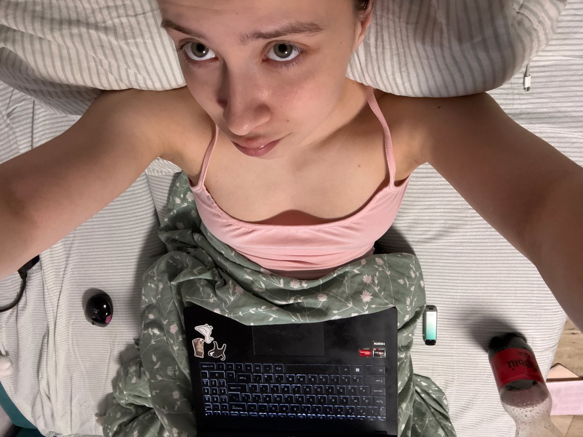 Morning work-from-bed session with laptop in Russian city