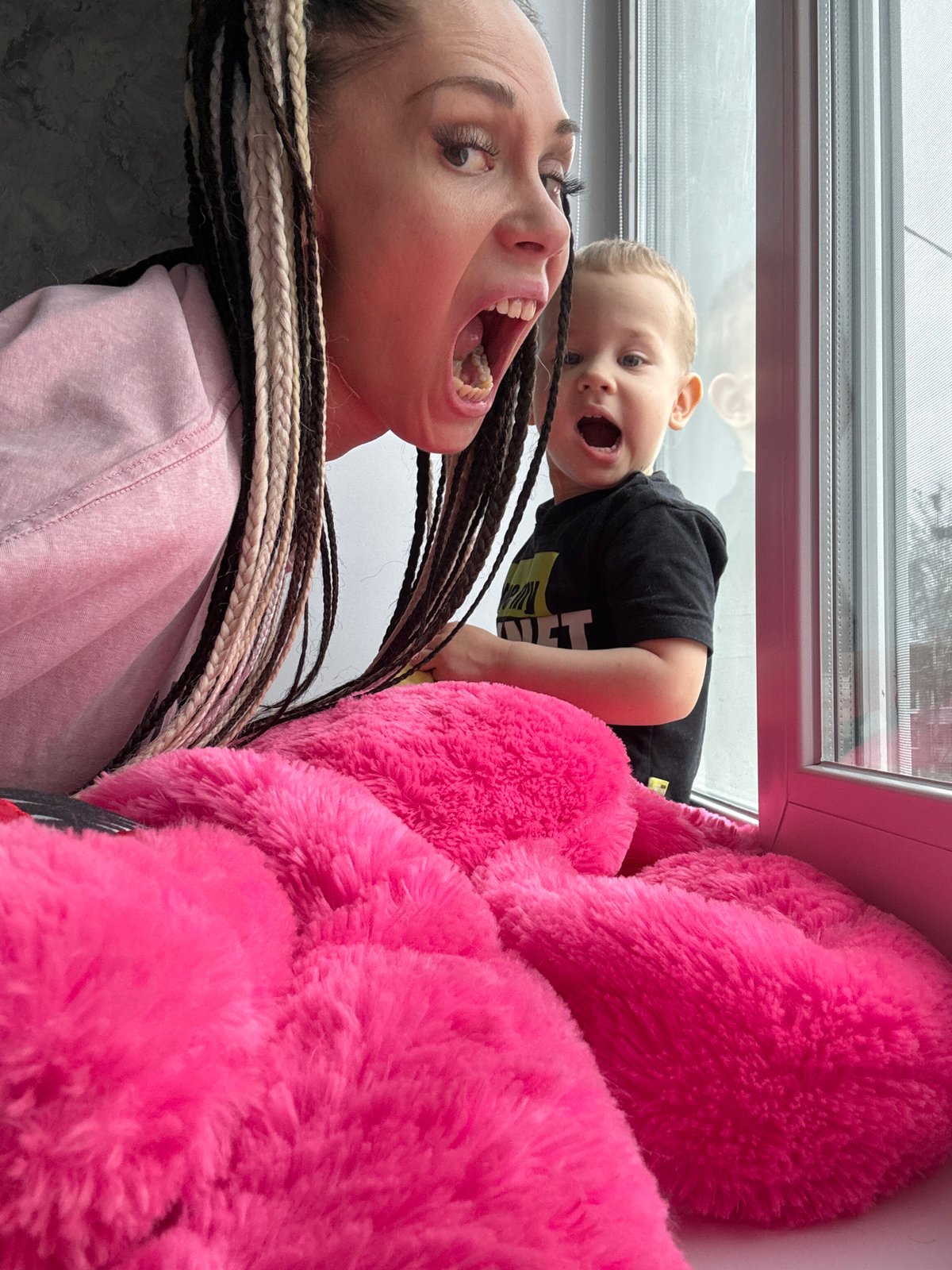 Mother and child share playful morning moments in Rusanovo