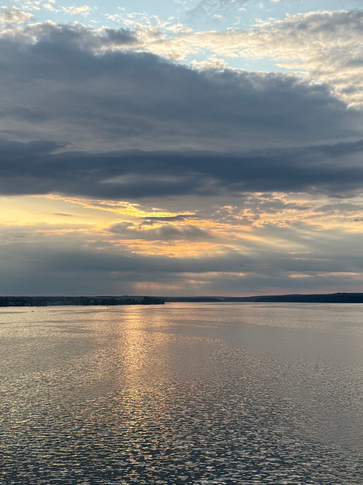 Sunset clouds break over Votkinsk Reservoir from above