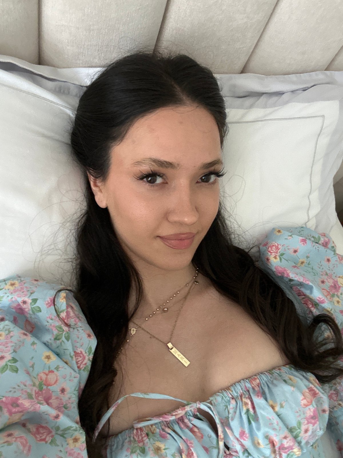 Woman photographed in close-up while lying in bed in Dubai