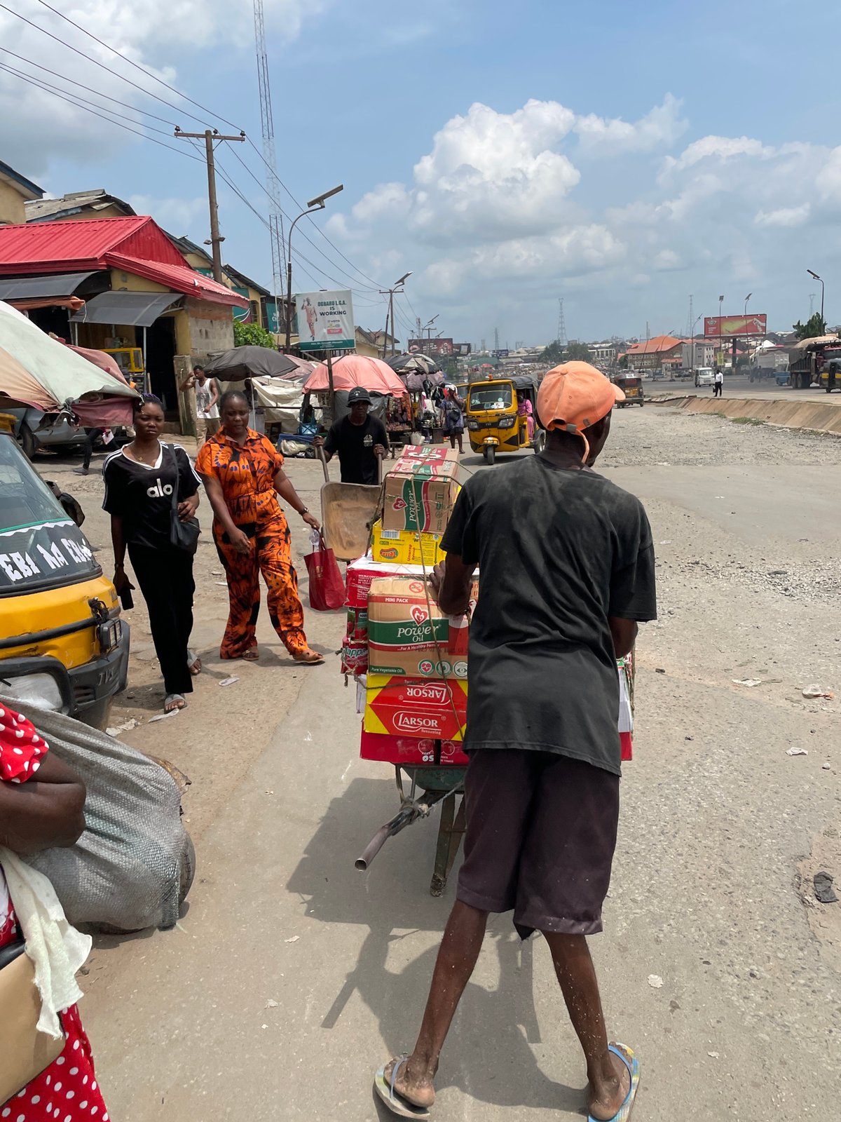 Daily market life documented across Nigerian commercial districts