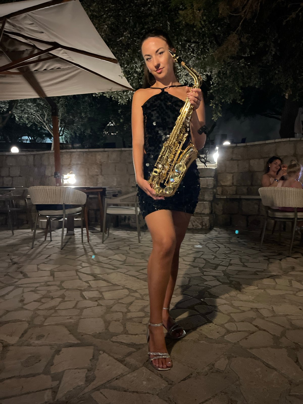 Live sax and DJ set at an outdoor night event in Montenegro