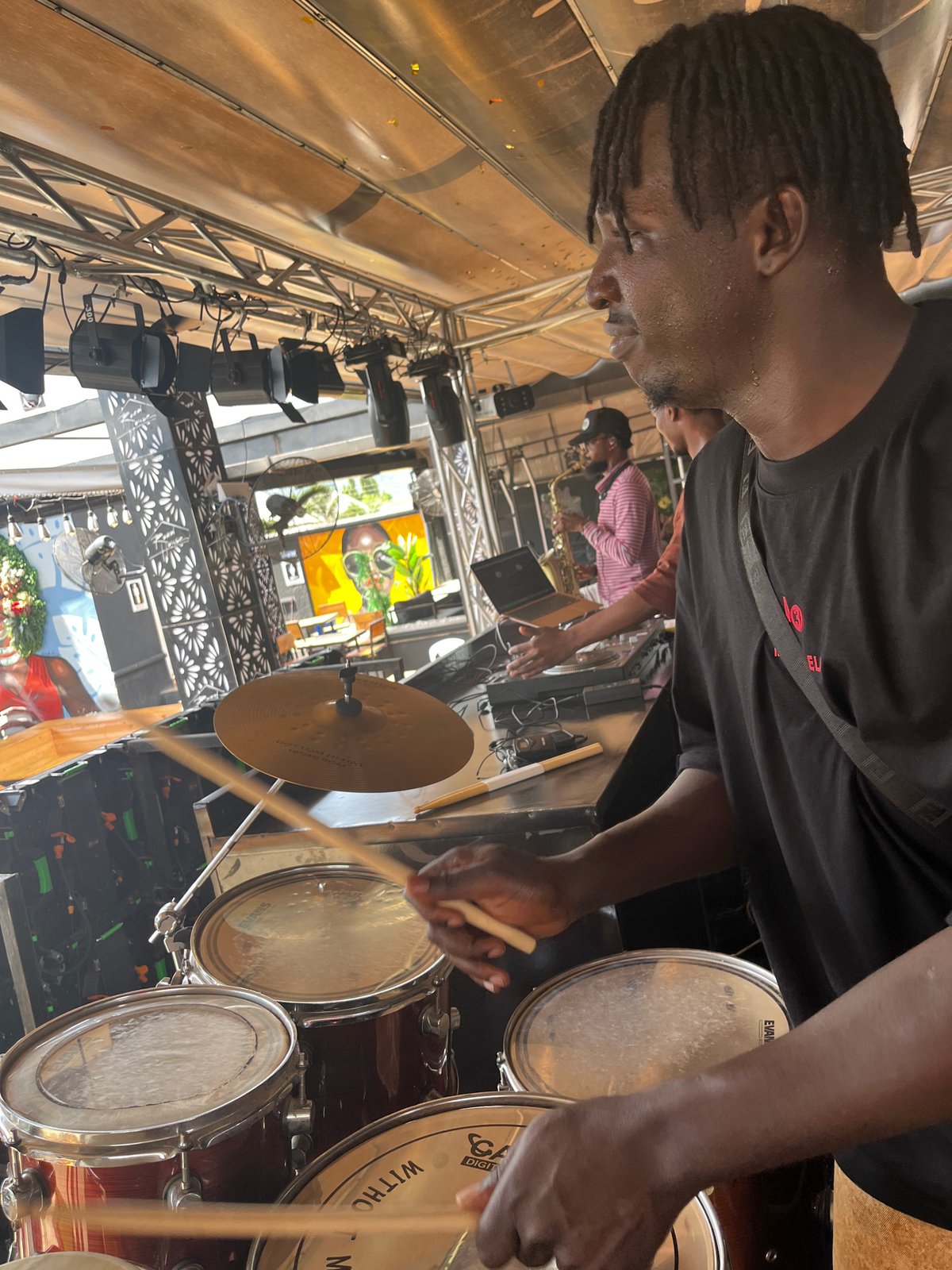 Outdoor event in Howayi with live music, DJs, and fried food