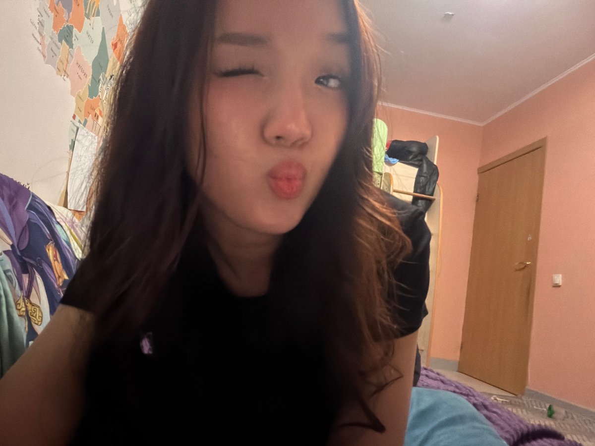 Woman takes artistic selfie session in Russian bedroom