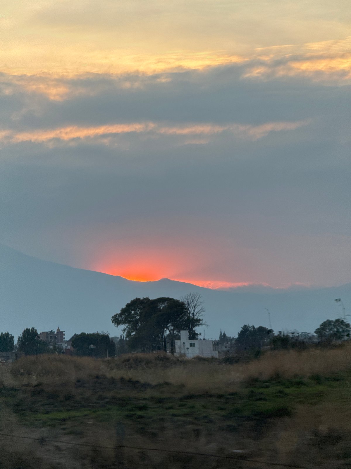 Bright orange light strikes mountain peak in Mexico