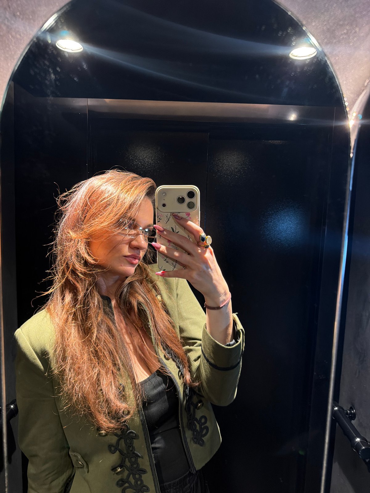 Mirror selfie captured in indoor Athens location