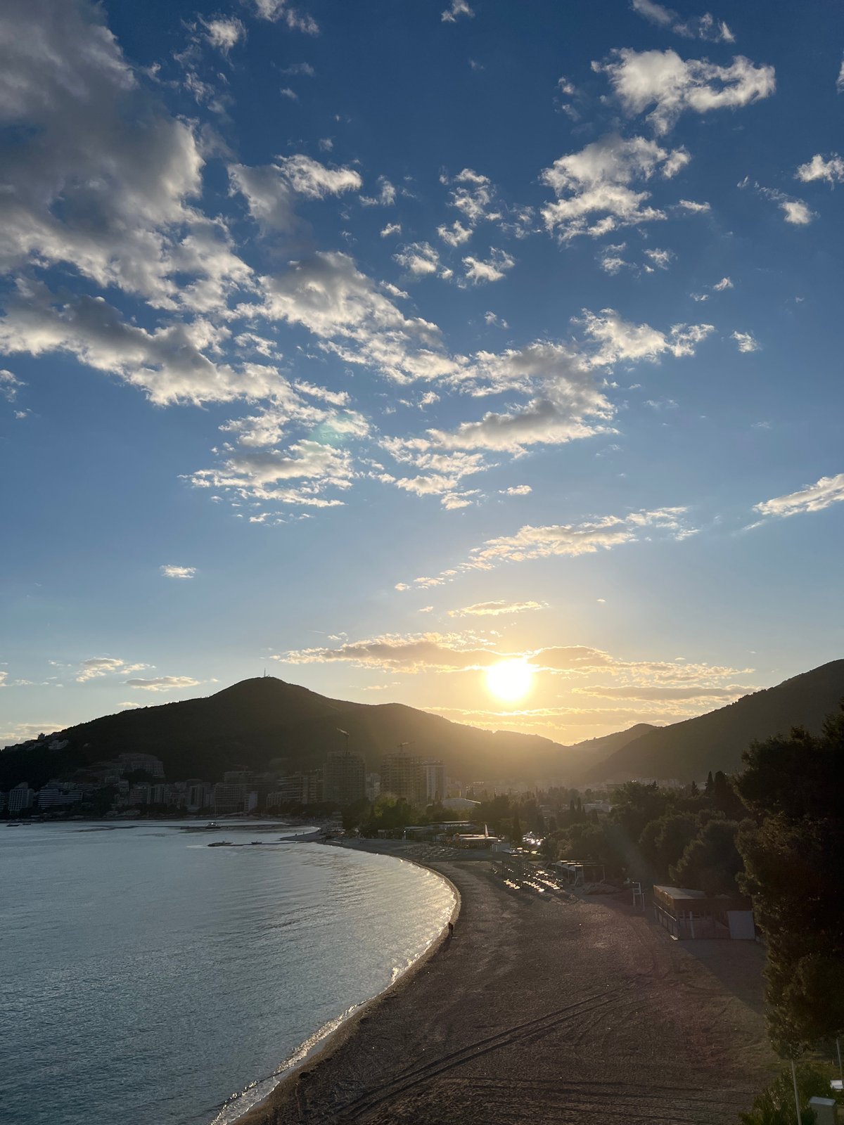 Sunset beach scenes documented along Budva's Adriatic coastline