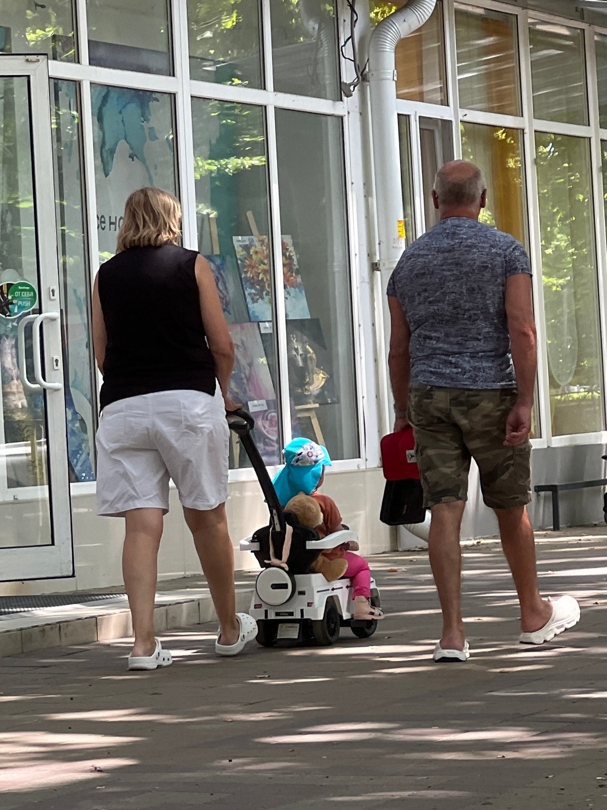 Weekday morning foot traffic along a Krasnodar commercial street