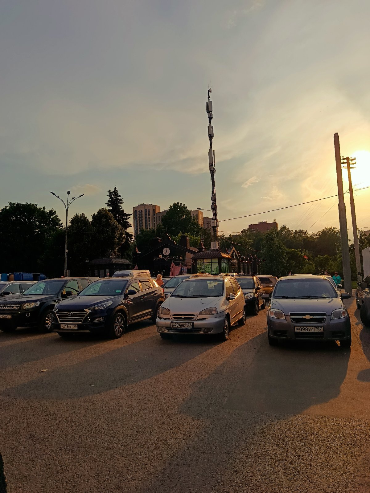 Moscow residents document ordinary evening street scenes during sunset