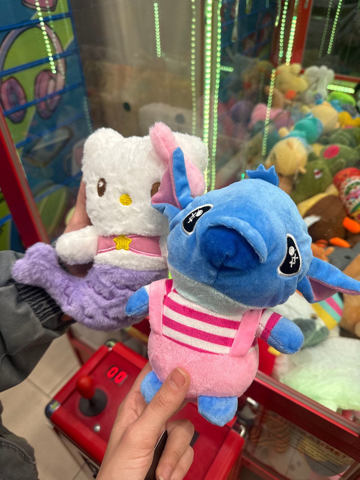 Woman plays claw machine at Krasnoyarsk arcade, wins plush toys