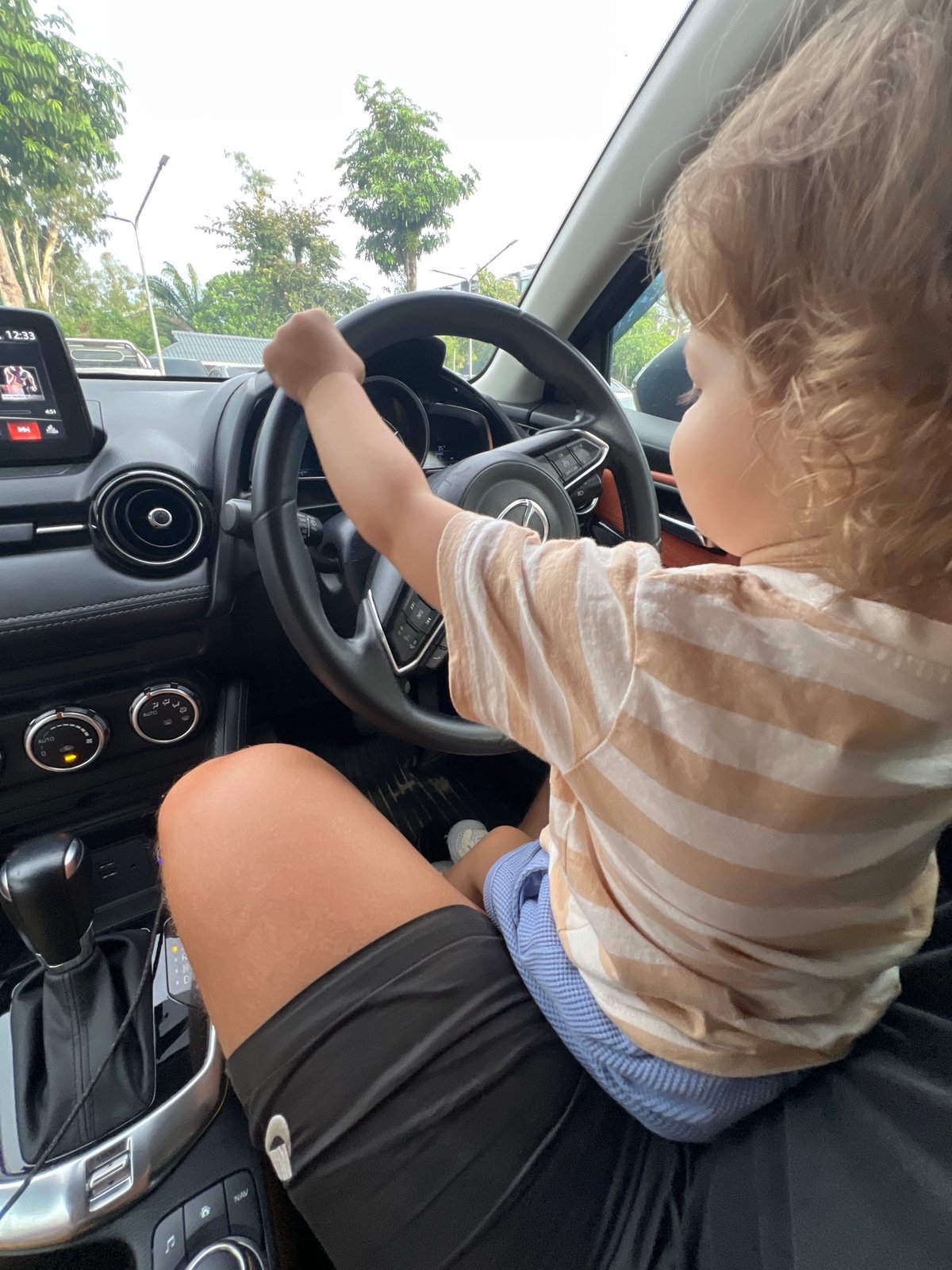 Family playground, beach, and car adventures captured throughout morning